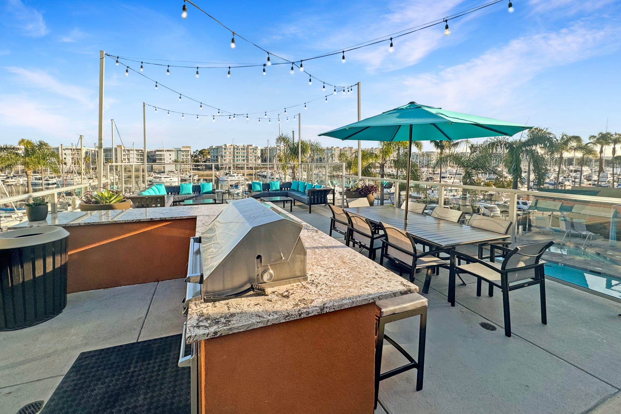 Rooftop lounge with a firepit and a view at Harborside Marina Bay Apartments in Marina del Rey, California