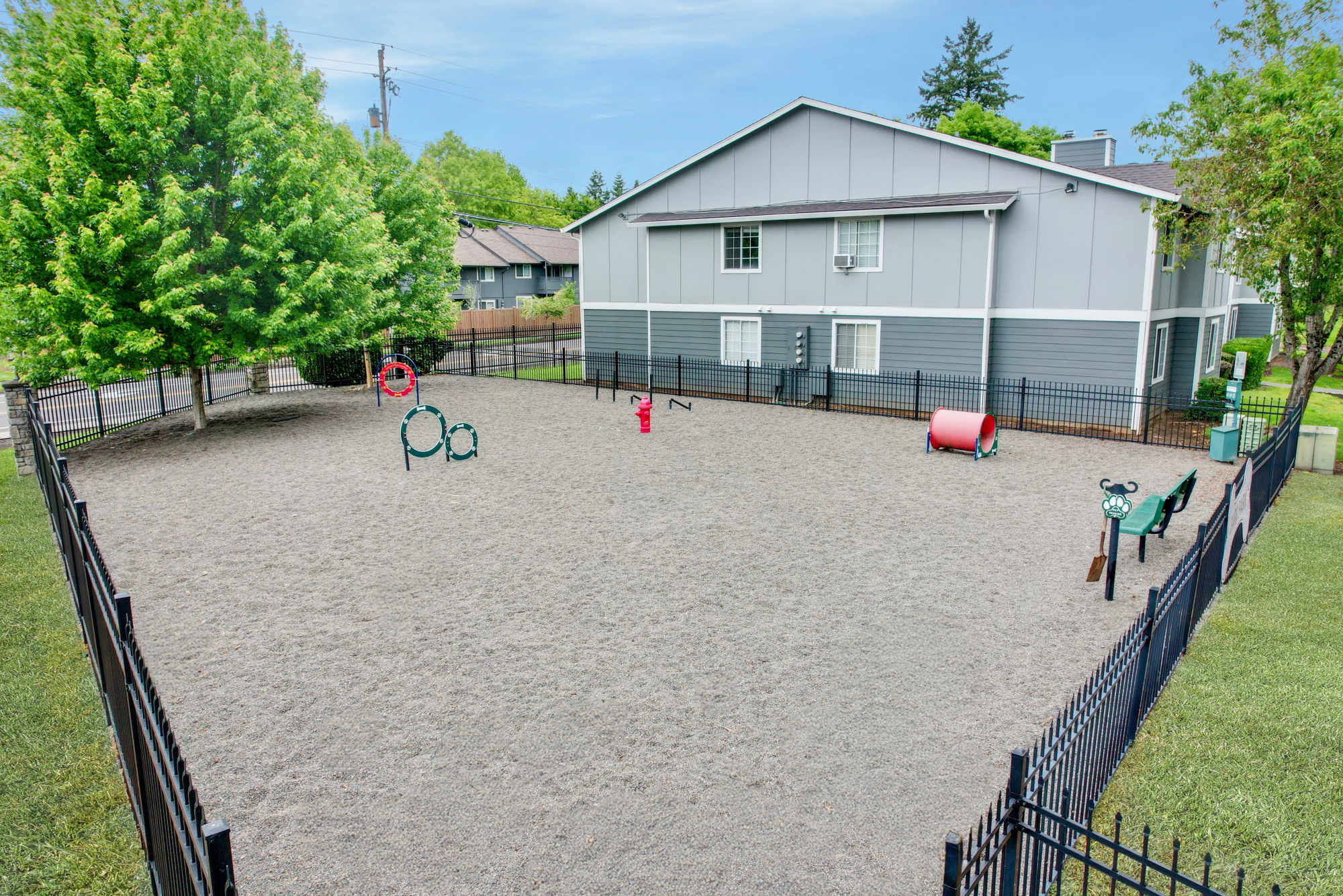 Onsite off-leash dog park with toys at Walnut Grove Landing Apartments in Vancouver, Washington