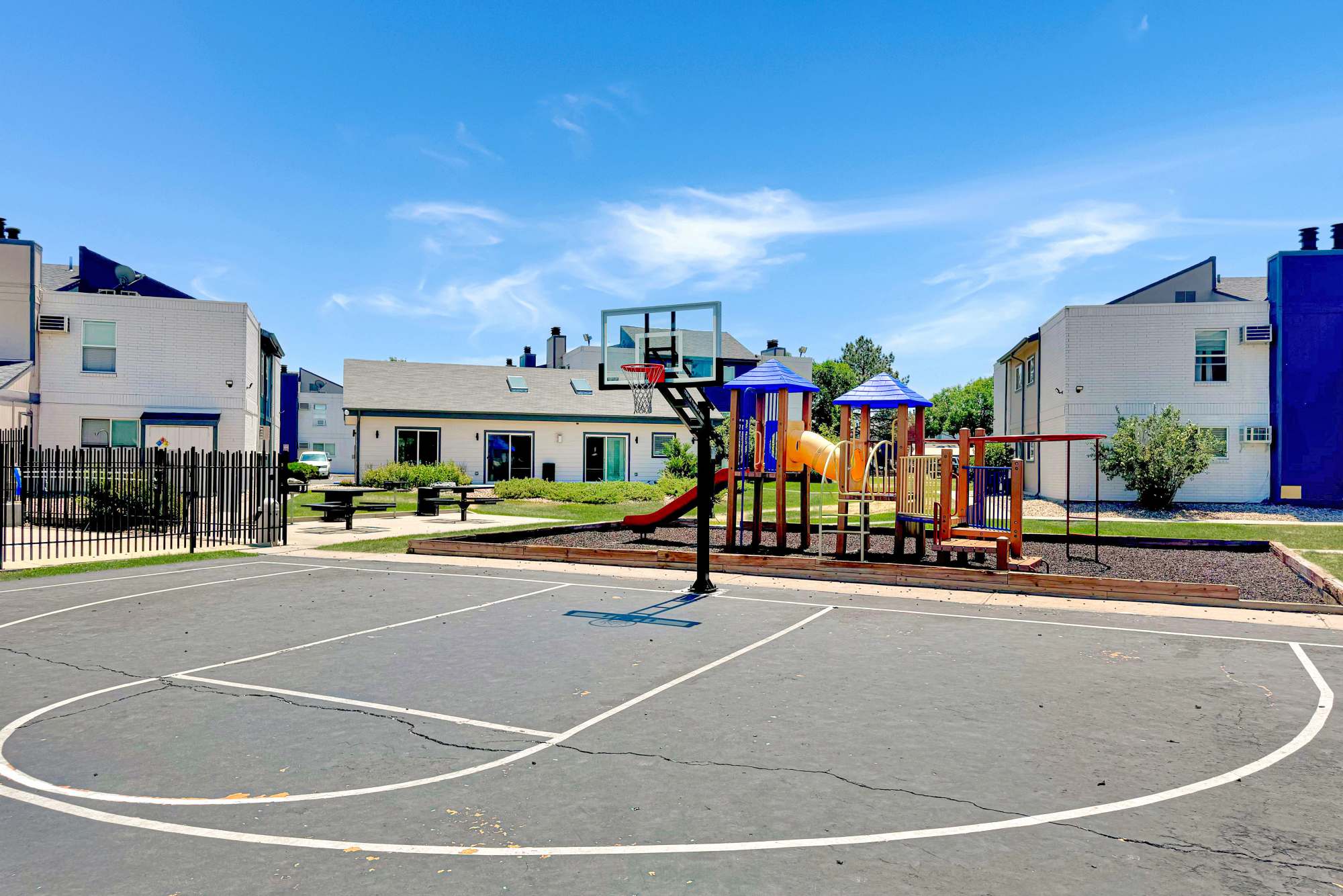 A basketball court next to the playground at Ascent at Lowry in Denver, Colorado