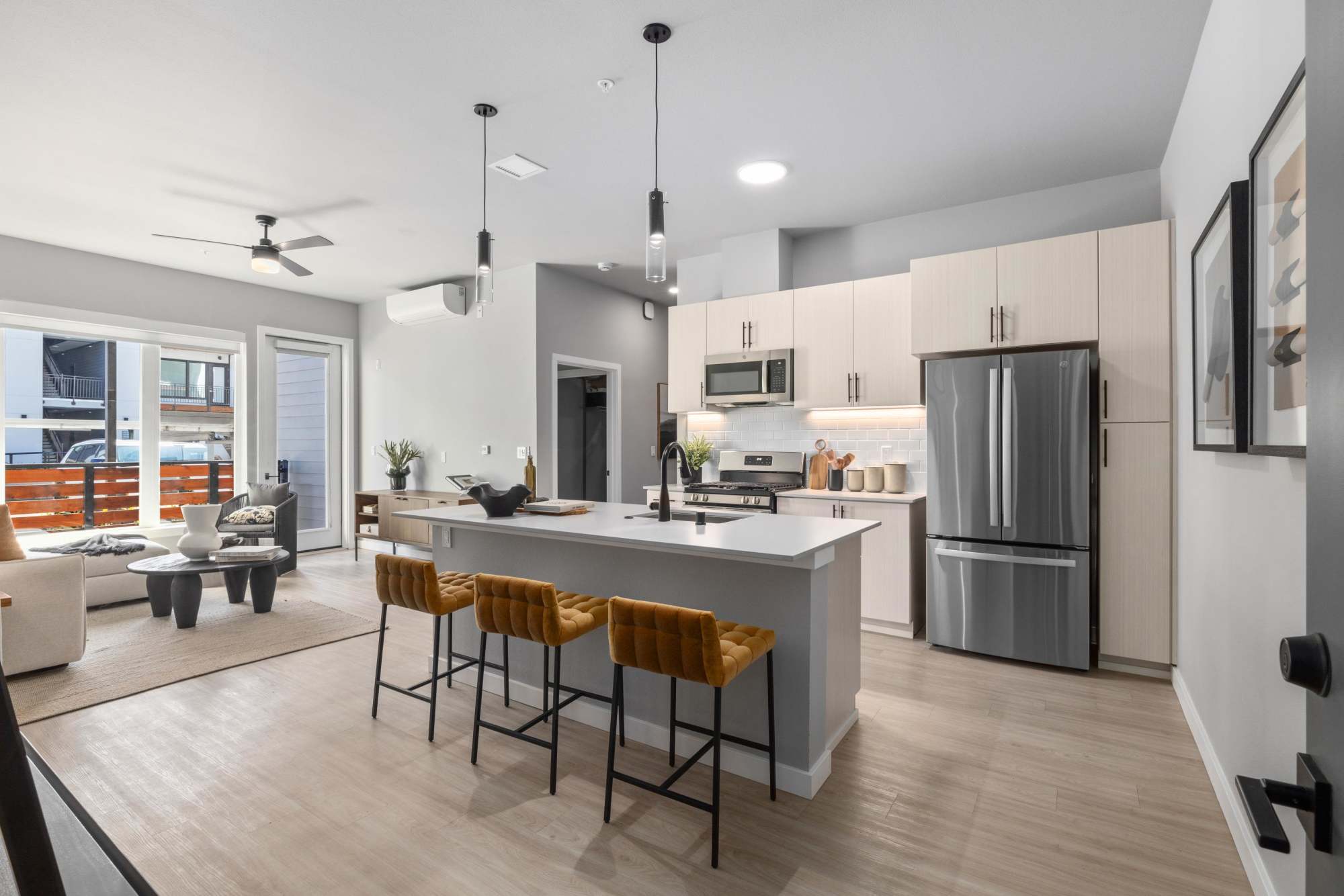 Kitchen with Tan Cabinets and Island at The Highlands at Silverdale in Silverdale, Washington