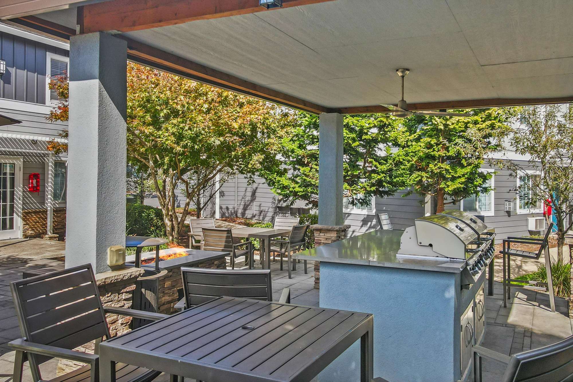 Fire pit and barbecue area at The Addison Apartments in Vancouver, Washington