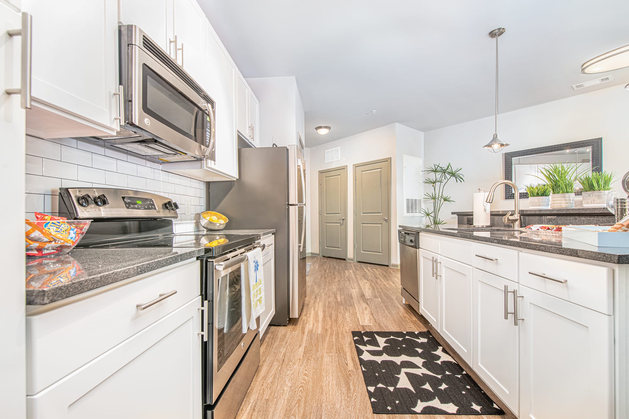 Large kitchen with stainless-steel appliances in a model home at 400 RHETT in Greenville, South Carolina