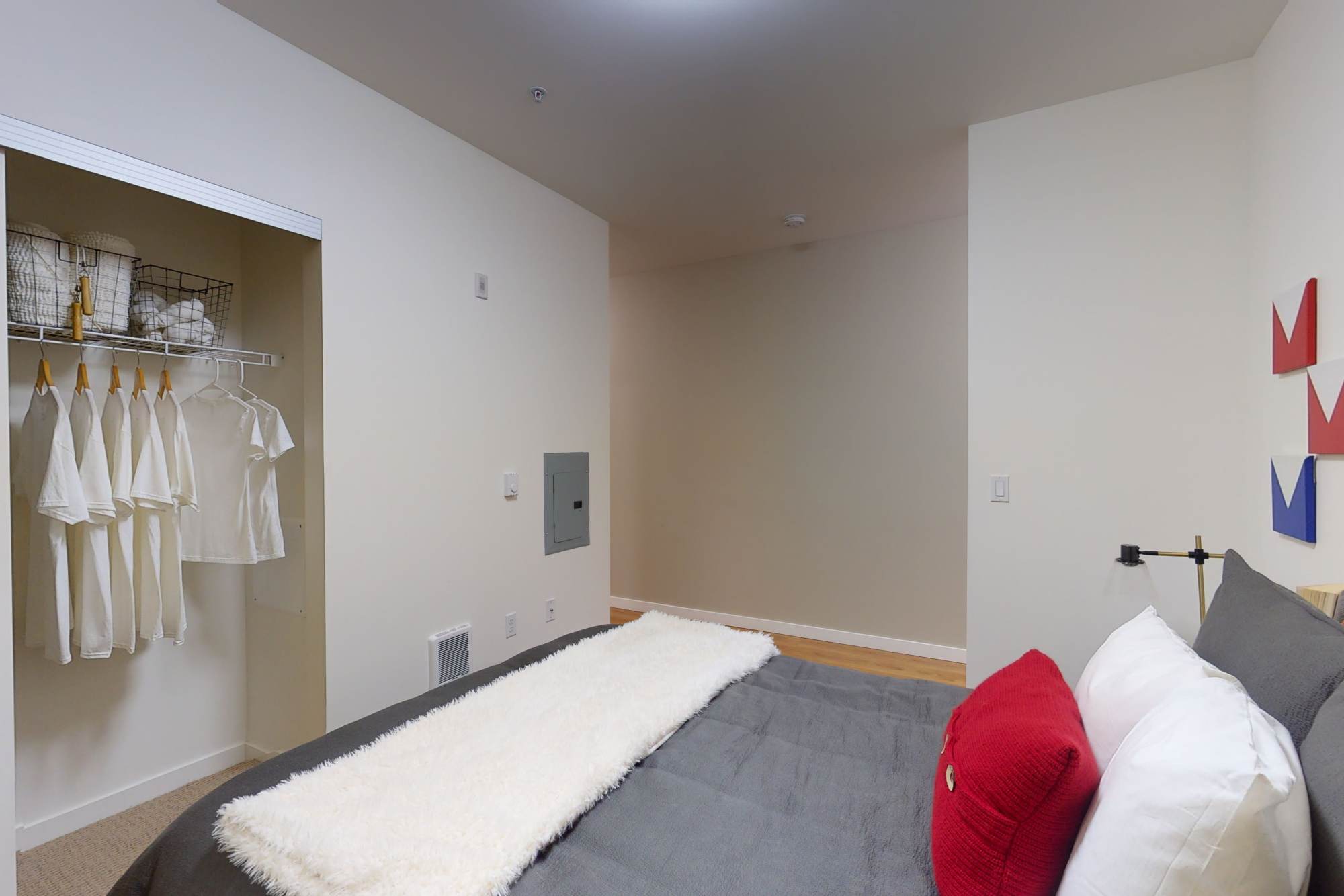 Bedroom with large closet and a comfortable bed at The Union in Portland, Oregon