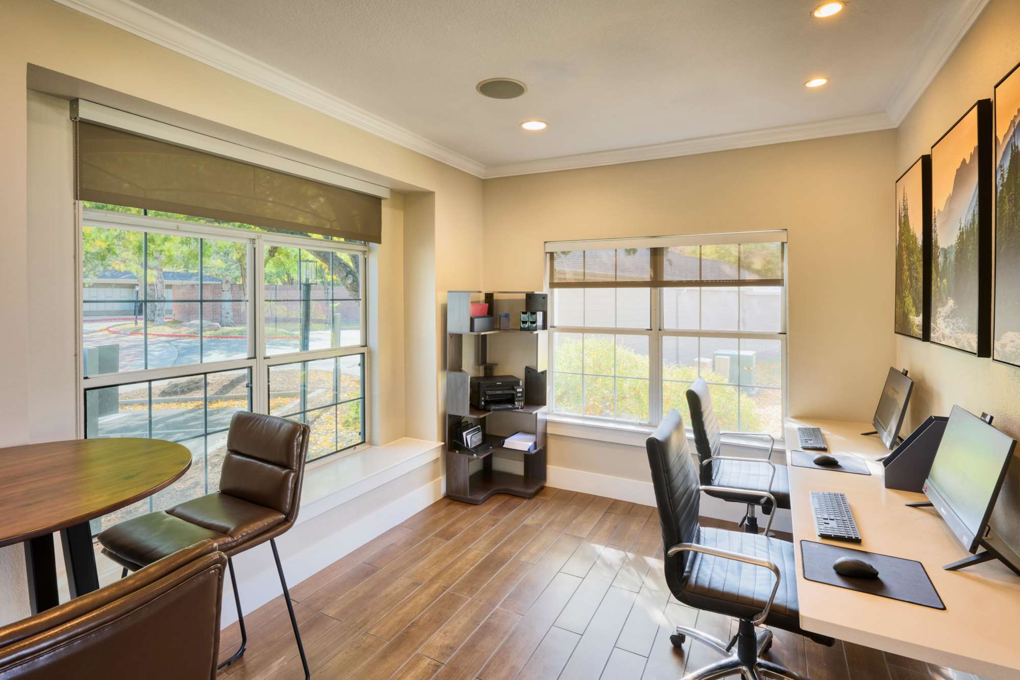 The business center with computers at The Crossings at Bear Creek Apartments in Lakewood, Colorado