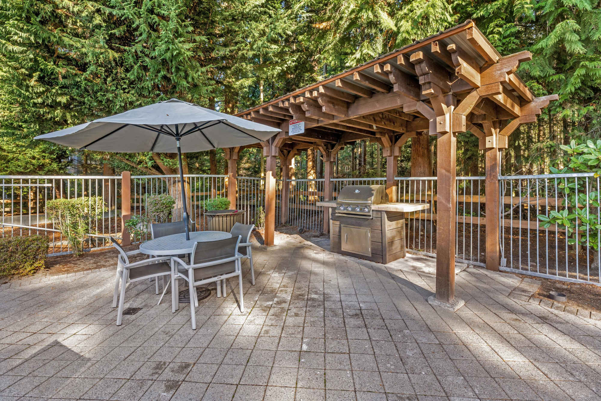The covered community BBQ area at Wildreed Apartments in Everett, Washington