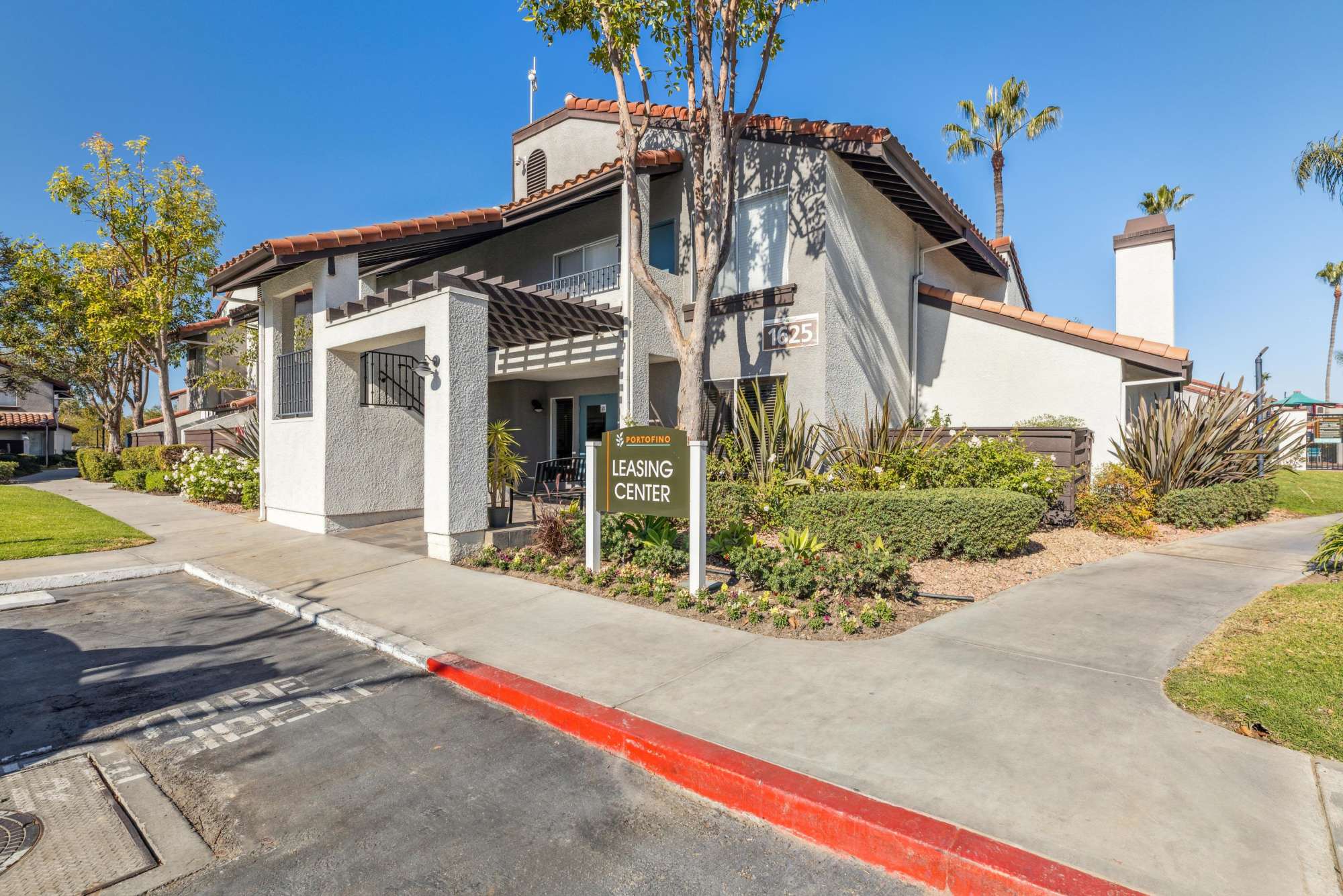 Exterior Clubhouse Entrance View at Portofino Townhomes in Wilmington, California