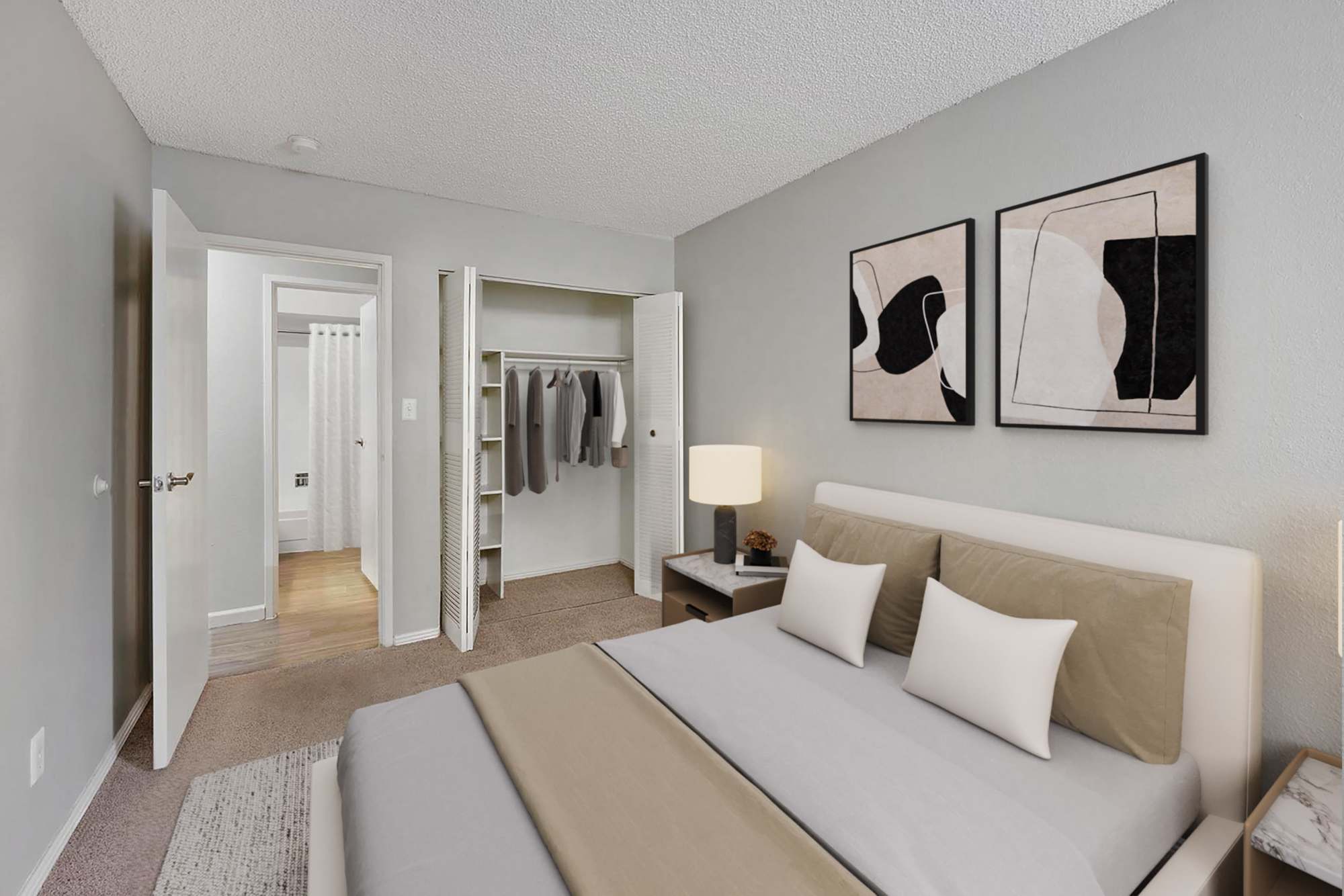 A king-sized bed in a model apartment bedroom at Ascent at Havana in Denver, Colorado