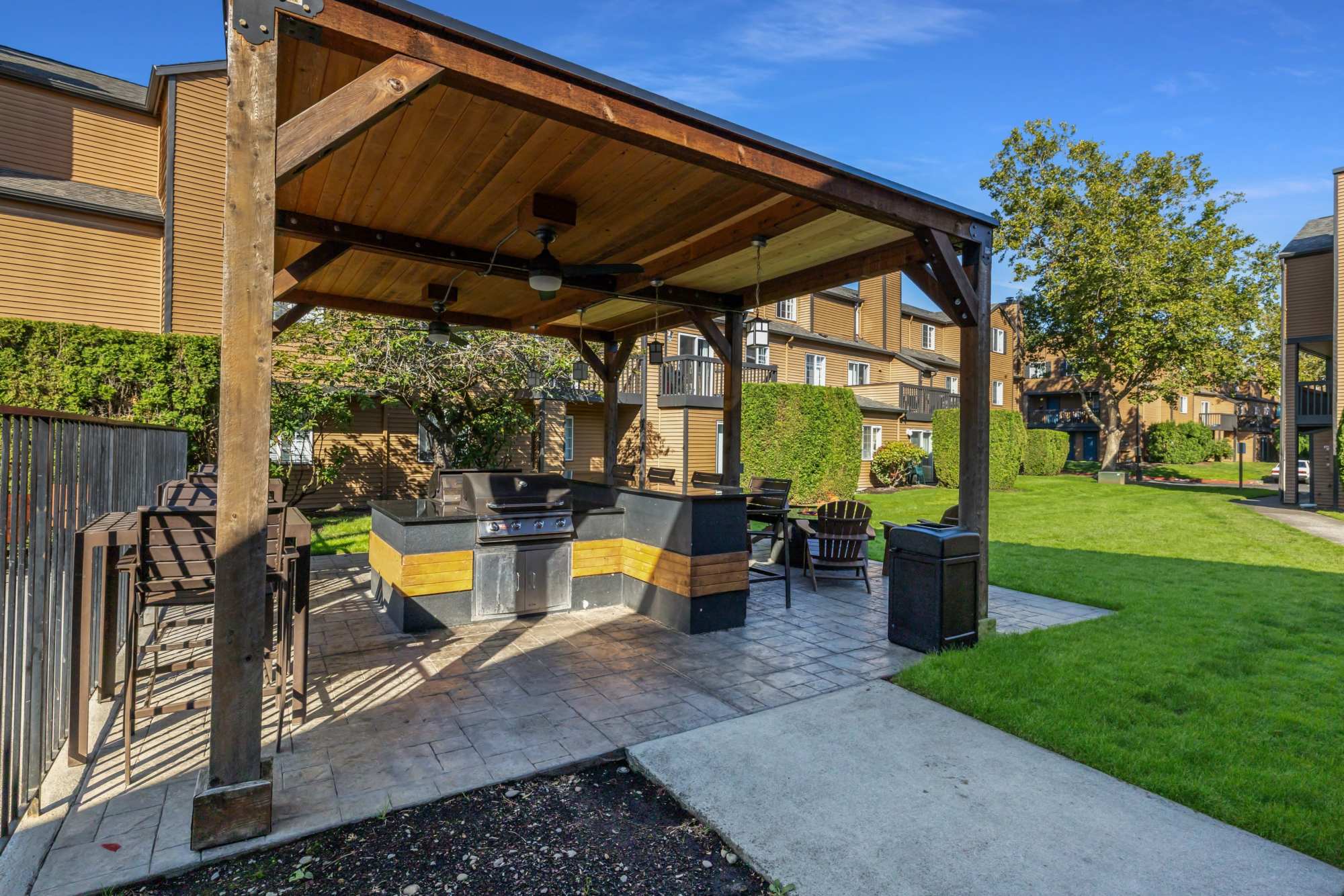 Outdoor patio with BBQ and grill at Renaissance at 29th Apartments in Vancouver, Washington