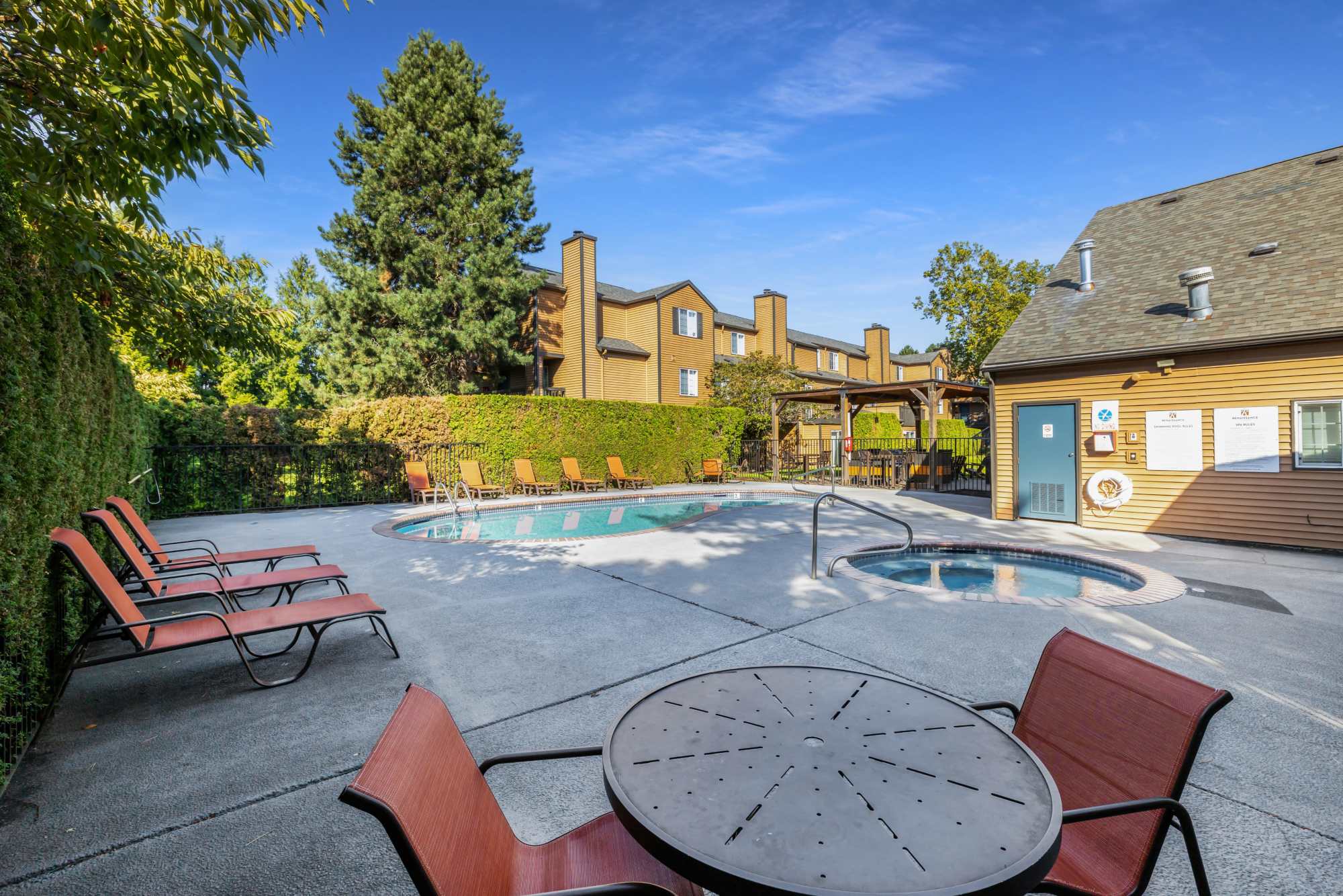 Outdoor sitting area by the pool at Renaissance at 29th Apartments in Vancouver,Washington