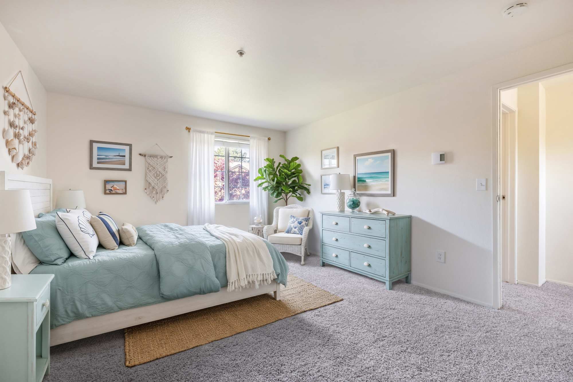 Cozy bedroom with carpet flooring at Renaissance at 29th Apartments in Vancouver, Washington