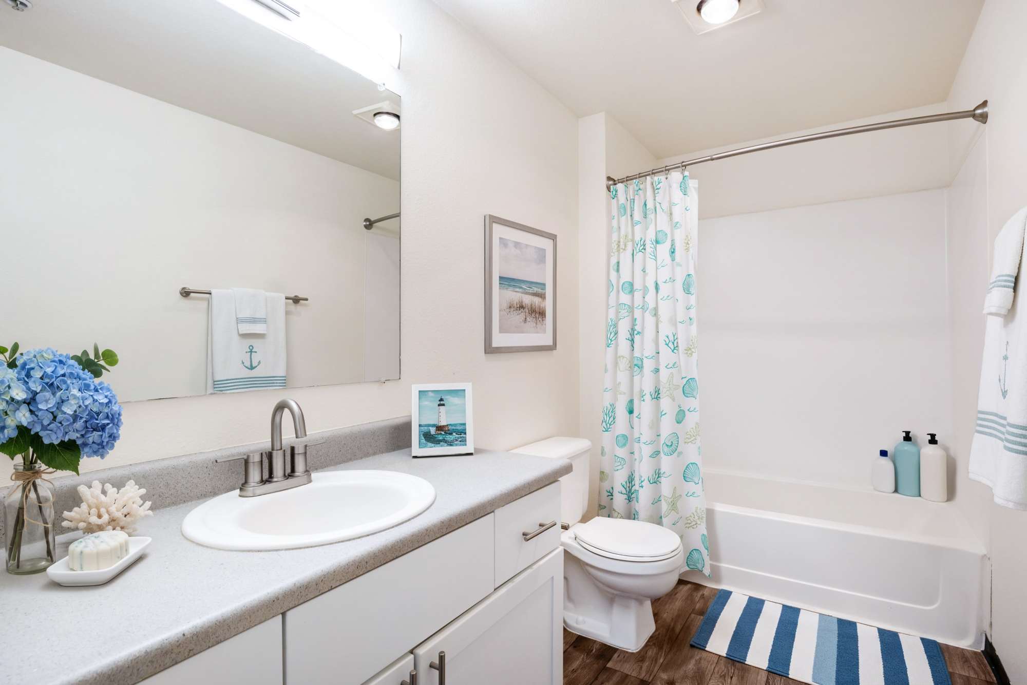 Bright bathroom with a white vanity unit at Renaissance at 29th Apartments in Vancouver, Washington