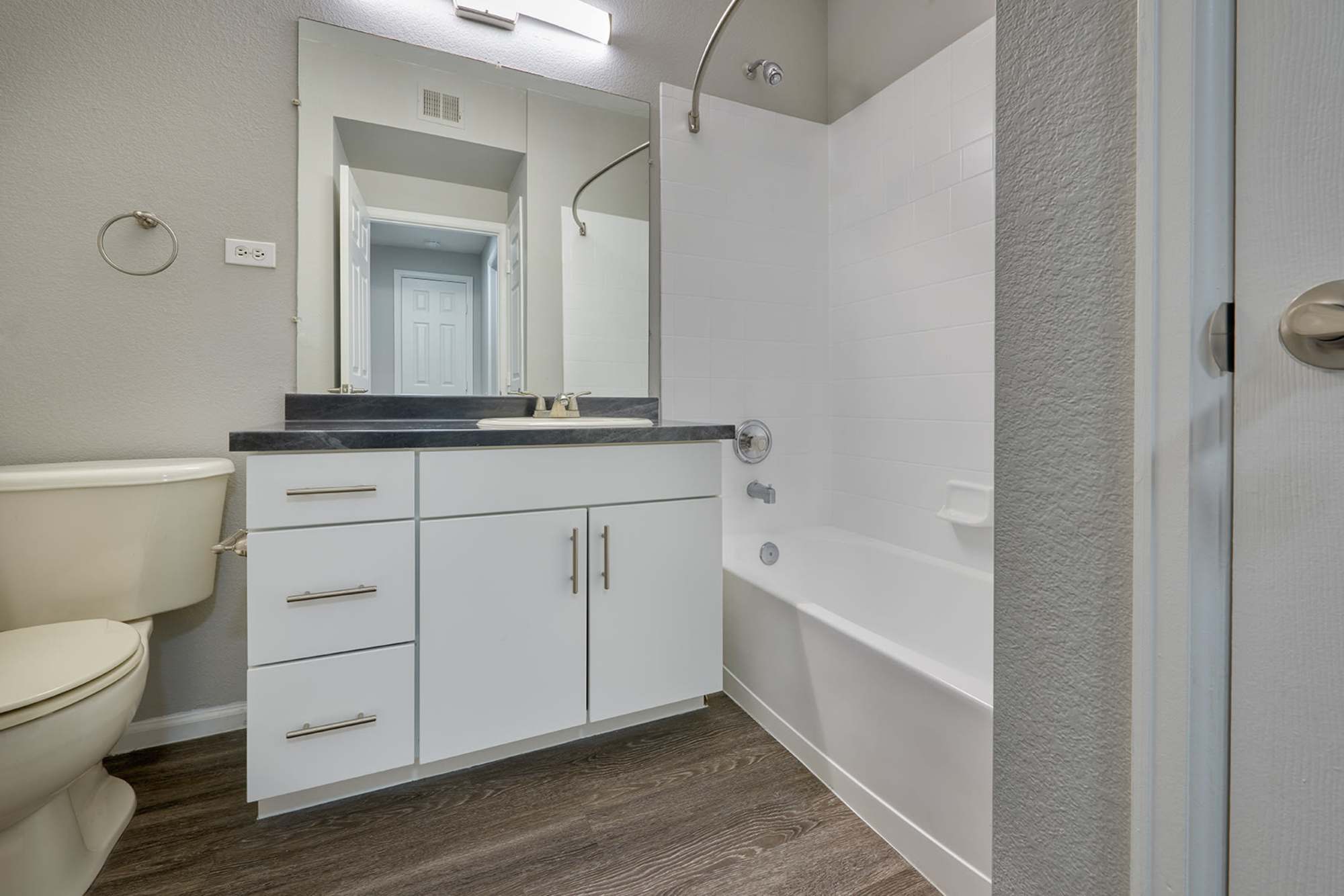 Washroom with cabinets at Crestone Apartments in Aurora, Colorado