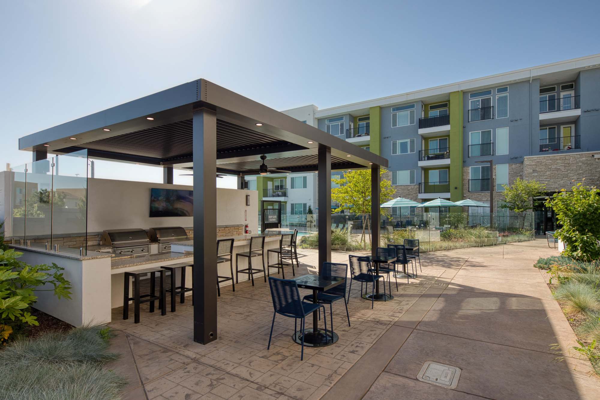 Community apartment view and covered grilling area at Sacramento, California