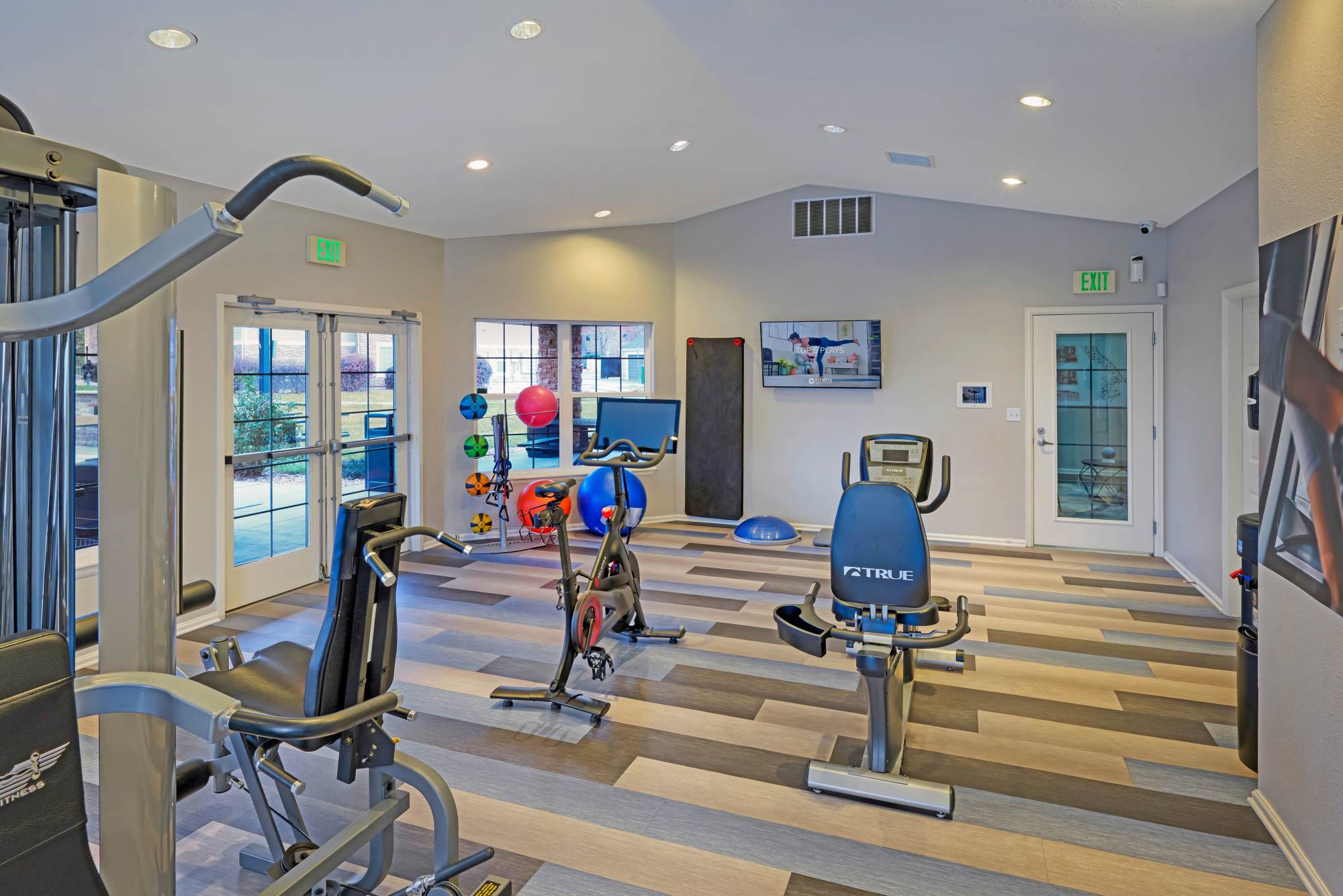 Fitness center with exercise ball and cycling machine at Westridge Apartments in Aurora, Colorado