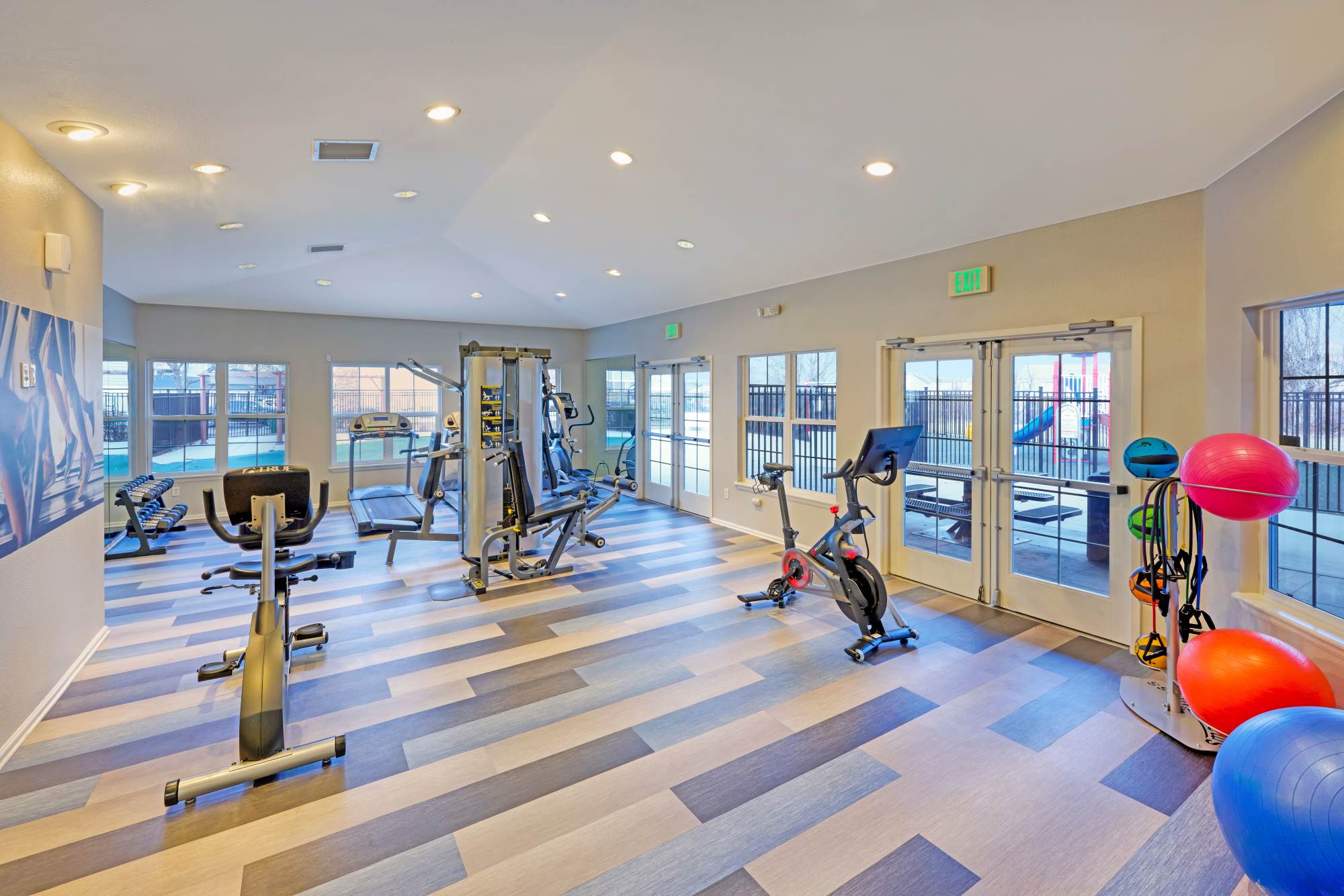 Fitness center with treadmill at Westridge Apartments in Aurora, Colorado