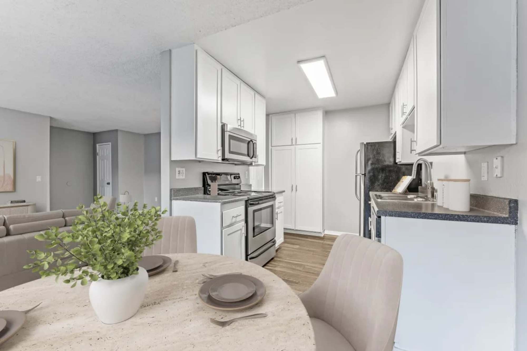 Dining area with view kitchen at Shadow Ridge Apartments in Oceanside, California