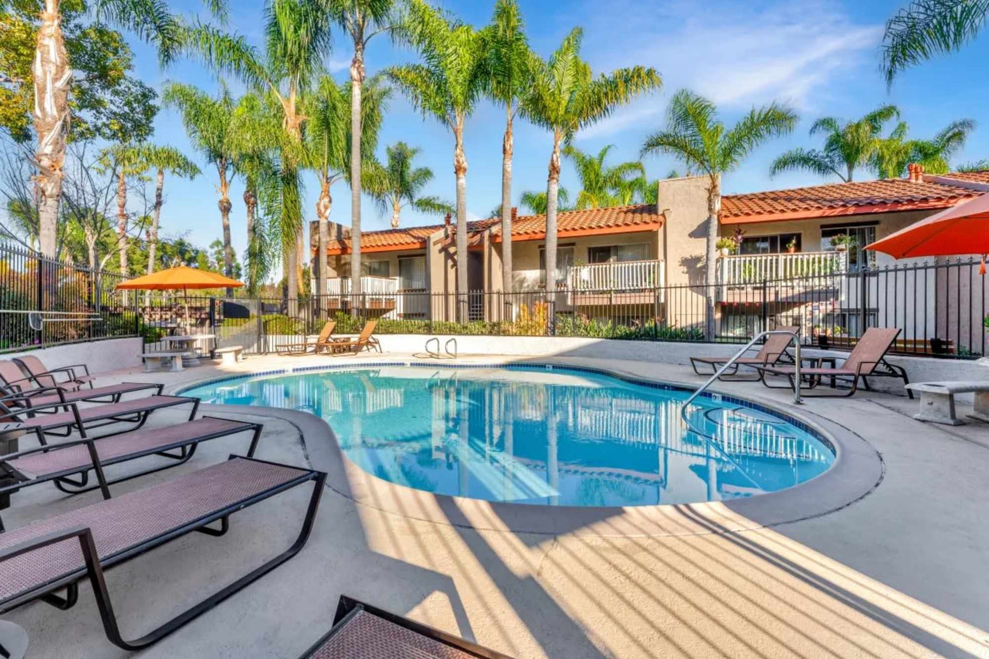 Pool with lounge chair at Shadow Ridge Apartments in Oceanside, California