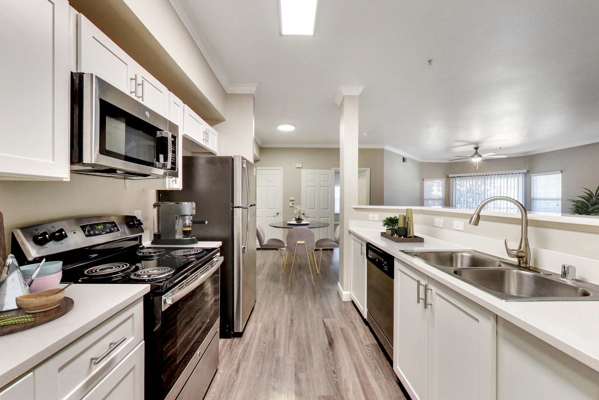 Kitchen with stainless-steel appliances at Avion Apartments in Rancho Cordova, California