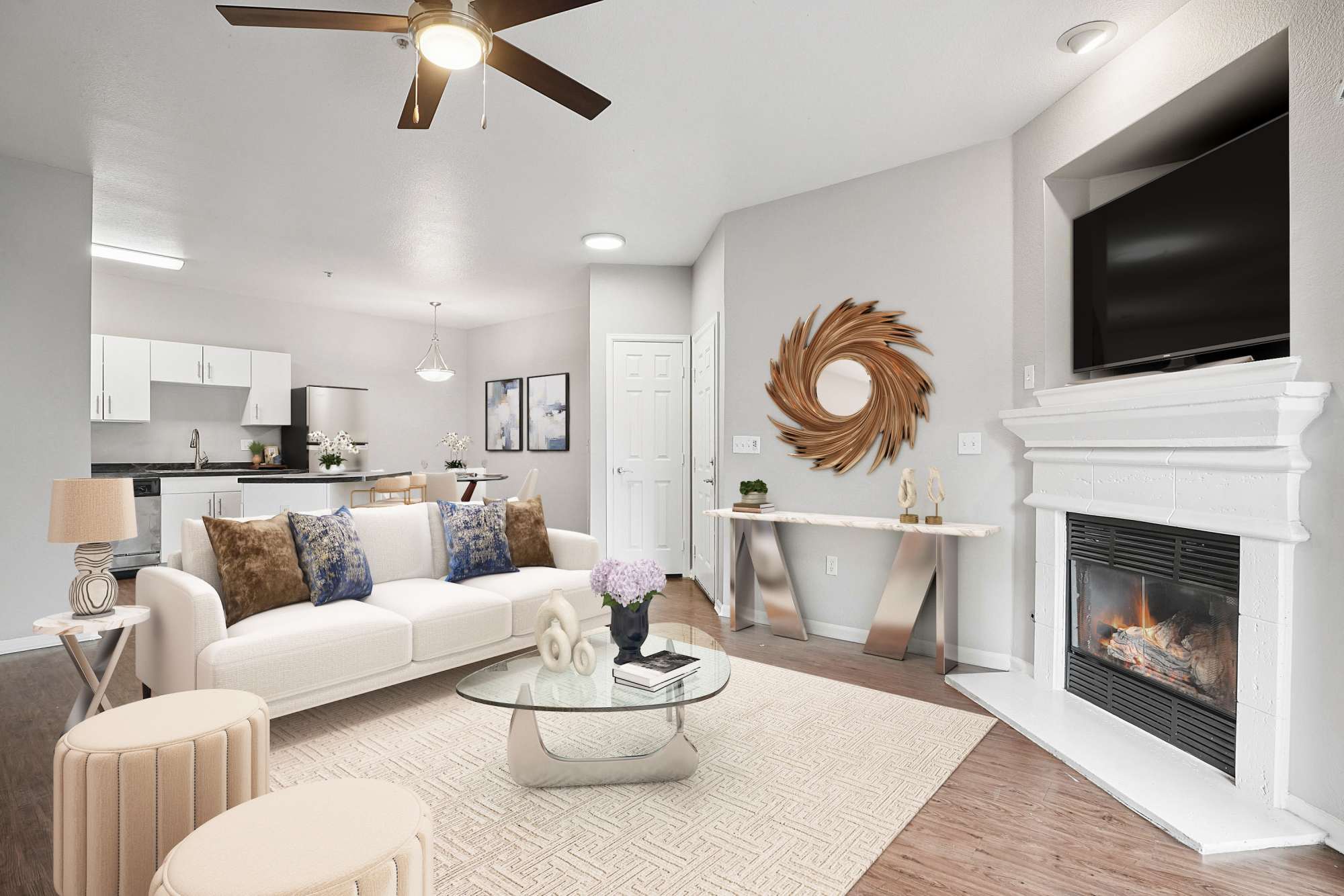 Spacious living room with wood-style flooring at Crestone Apartments in Aurora, Colorado