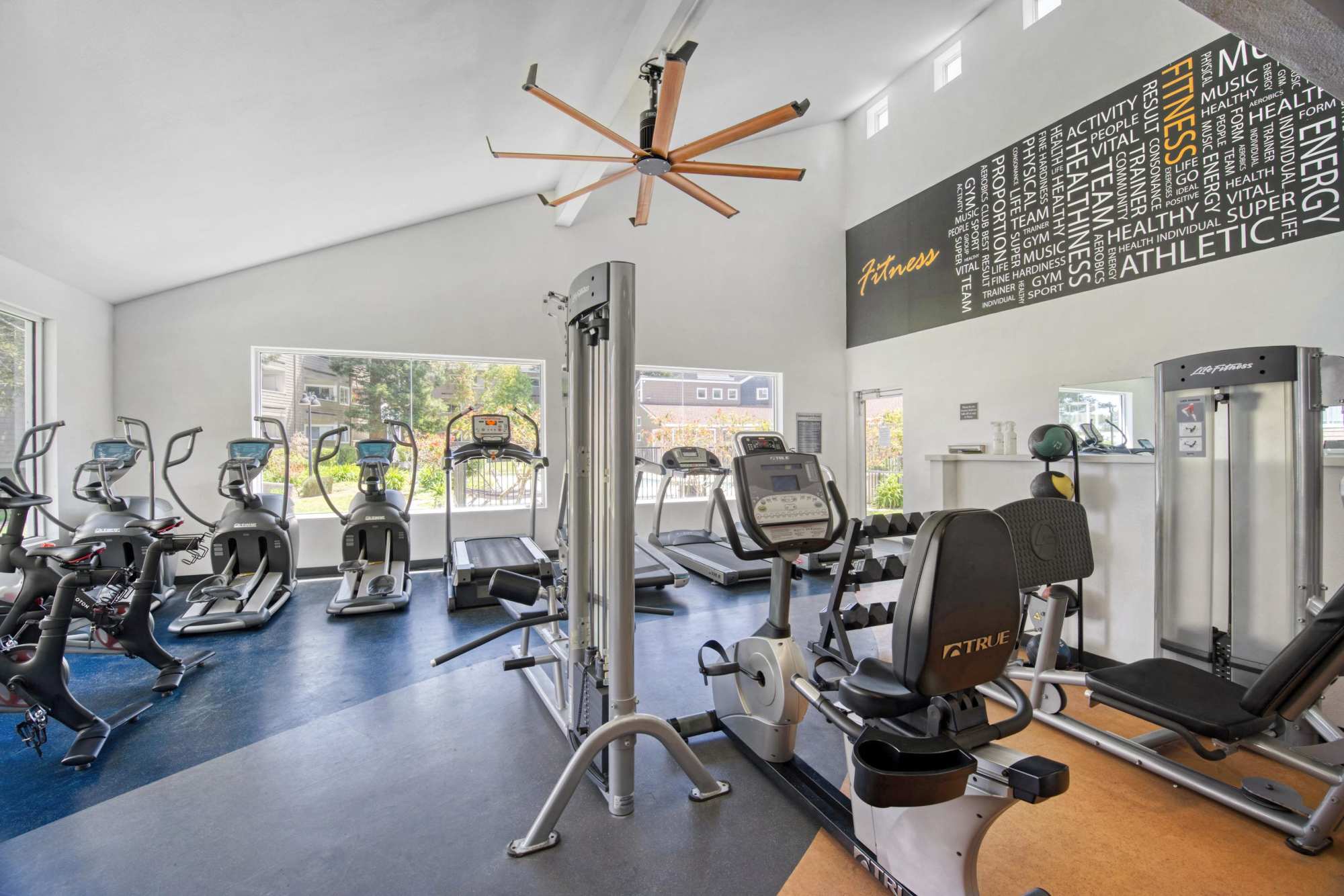 Full-Equipped Fitness Center with Cardio Machines and Weights at Serramonte Ridge Apartment Homes in Daly City, California