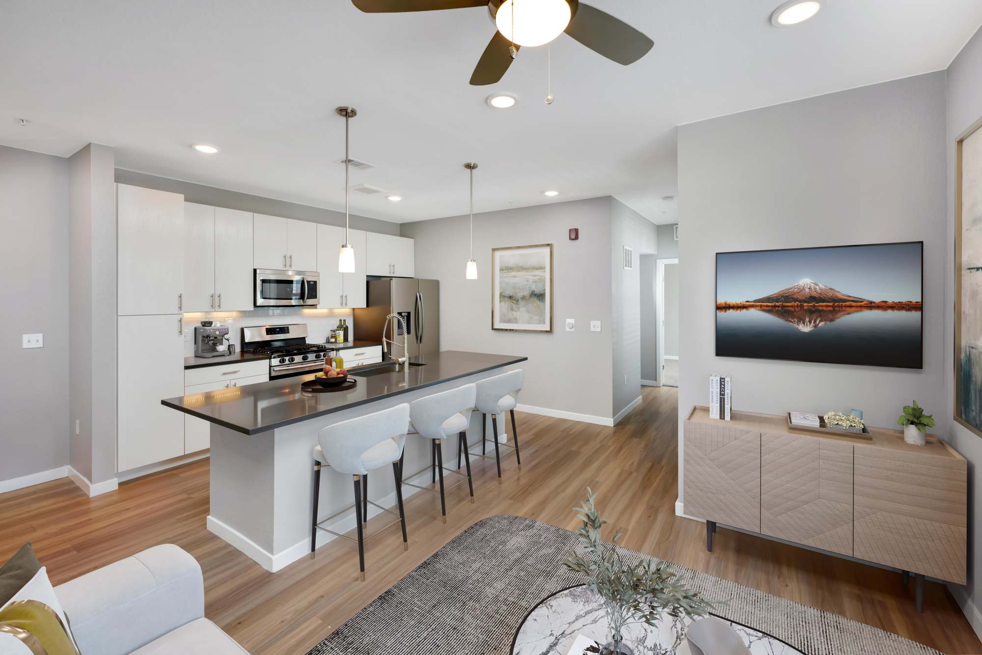 Large Spacious Kitchen and Living Room with Kitchen Island at Hawthorne Hill Apartments in Thornton, Colorado