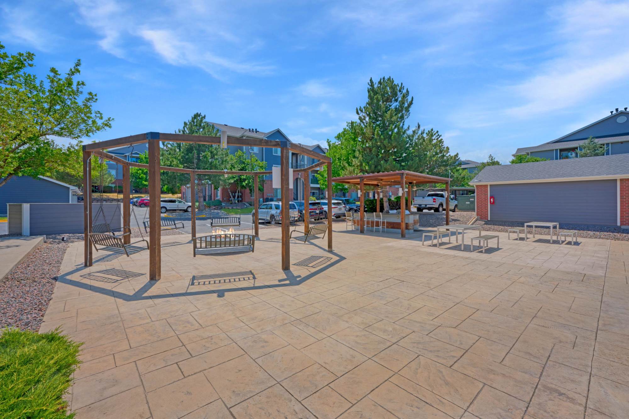 Fire Pit Swings and BBQ at Skyecrest Apartments in Lakewood, Colorado