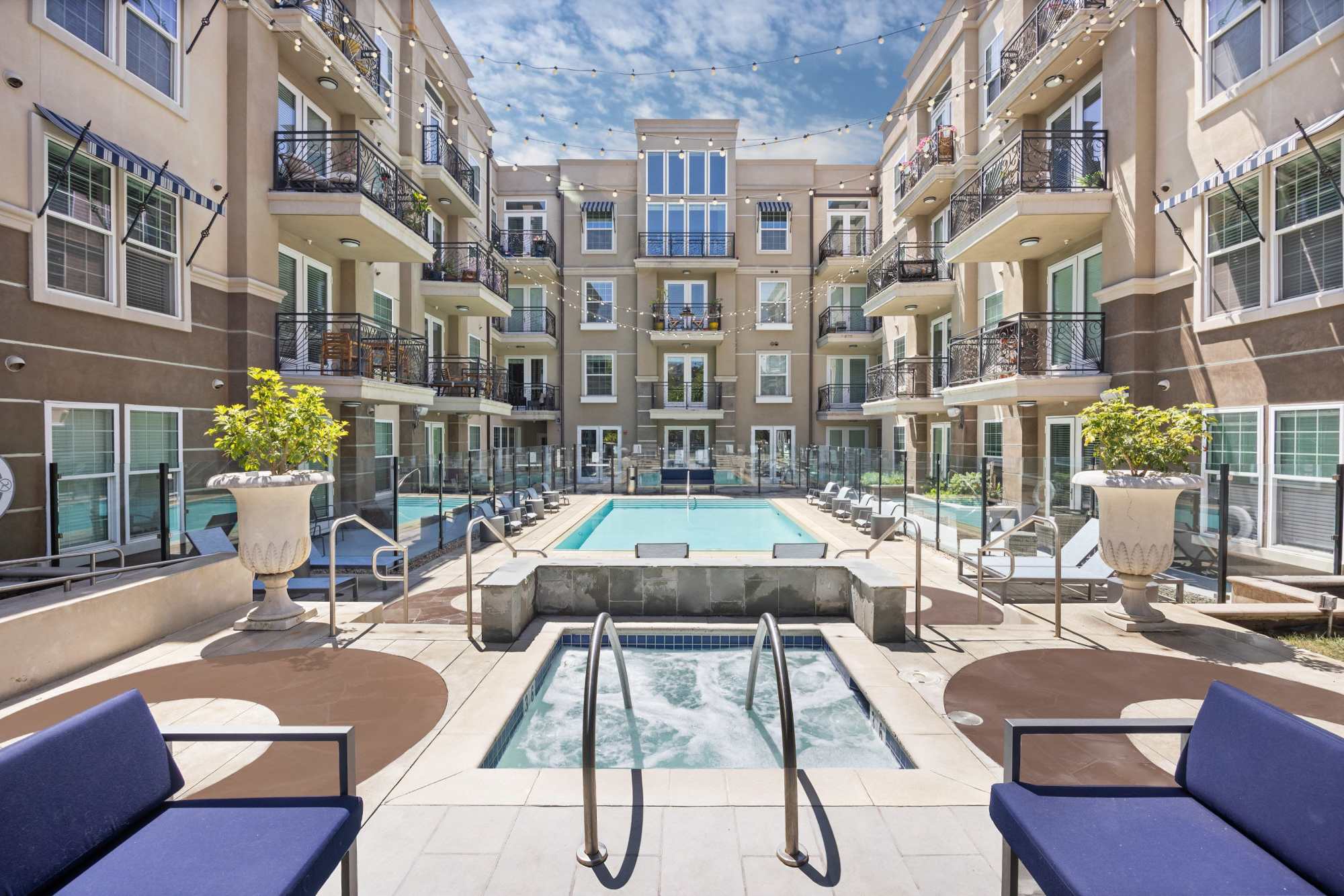 Central Pool Area with Poolside Lounges and Fire Pit with Aerial view of Area at La Belle at Hollywood Tower in Los Angeles, California