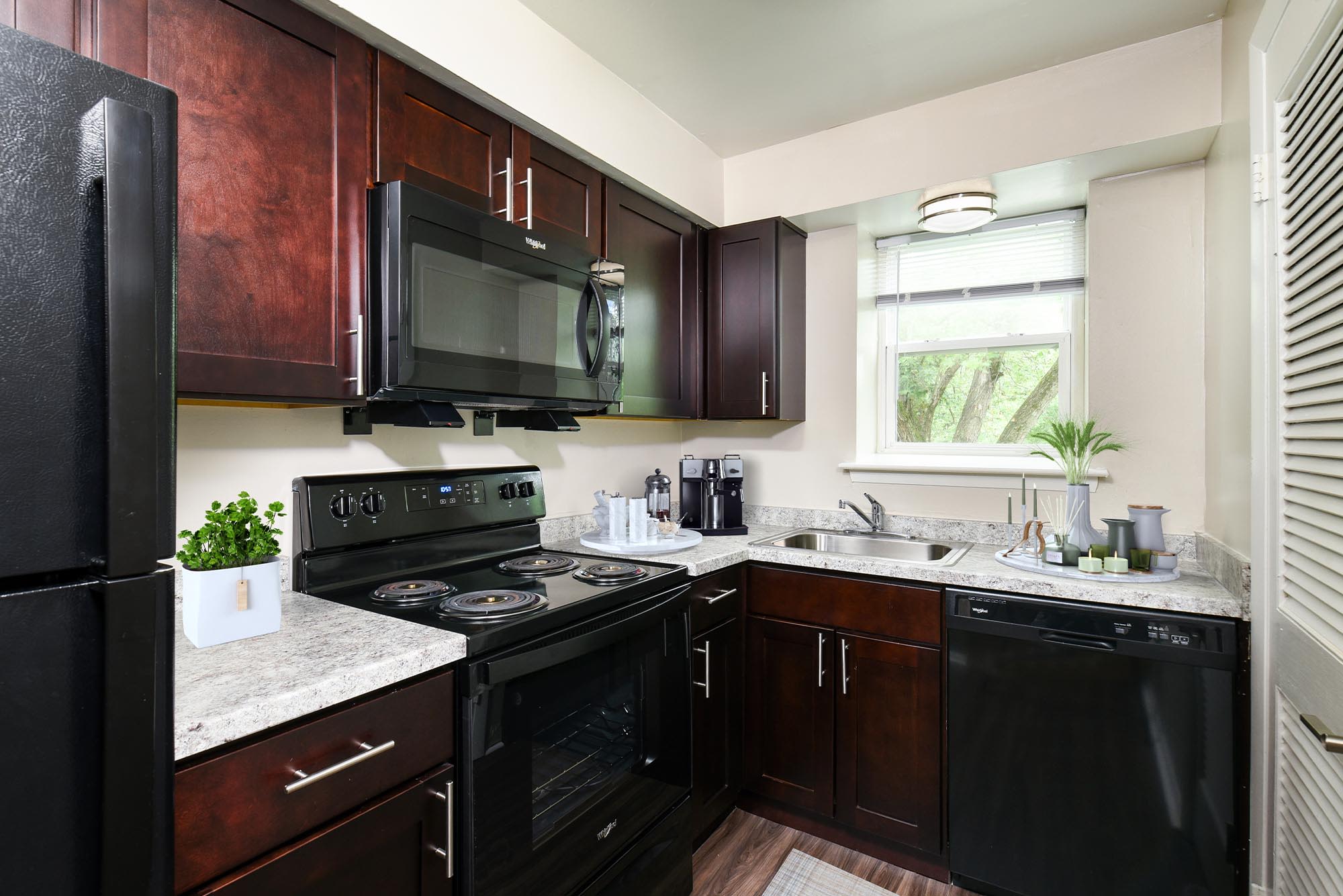 Kitchen with Black Appliances at Liberty Pointe in Newark, Delaware