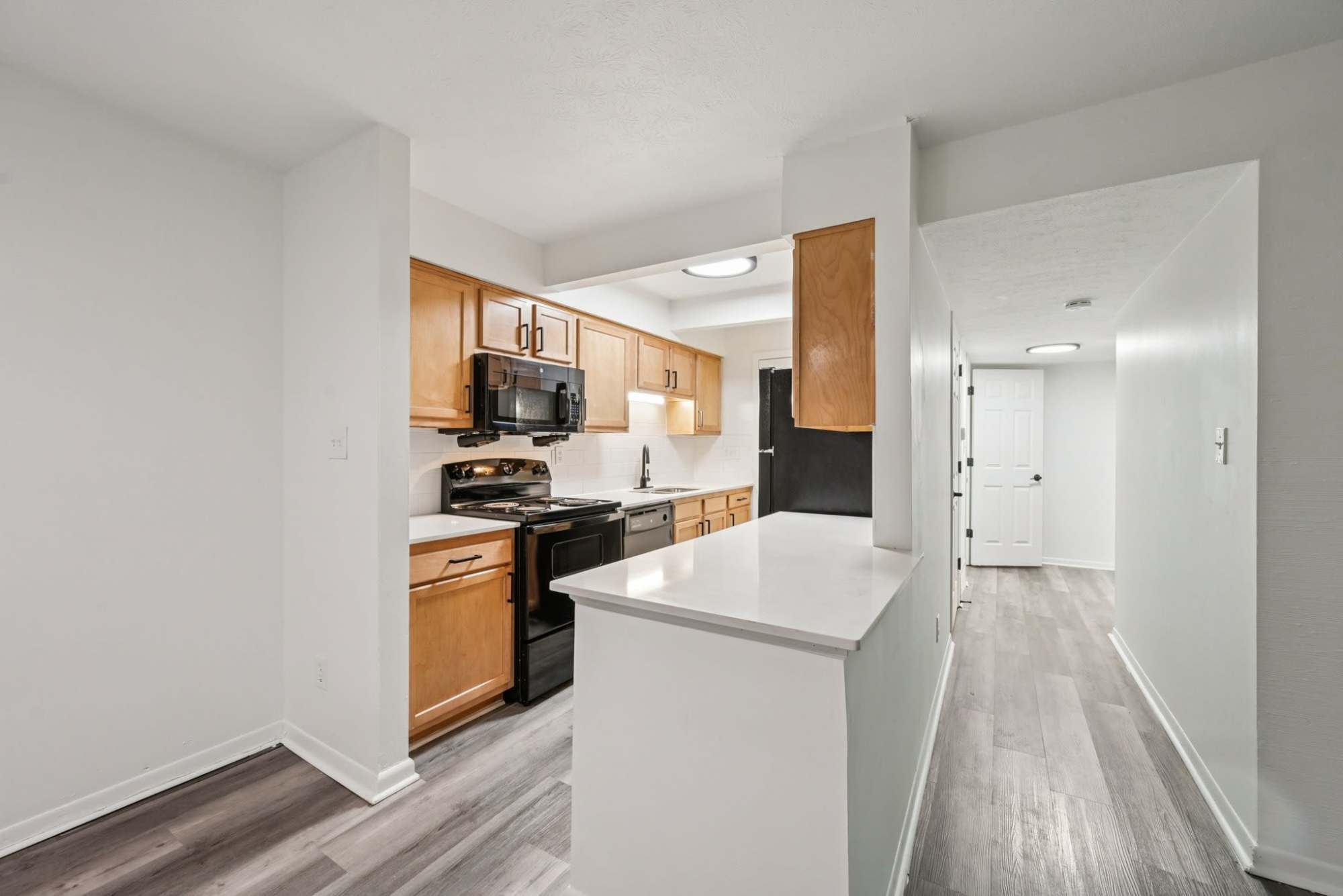 Renovated kitchen with plenty of countertop space at Pointe at Northern Woods in Columbus, Ohio