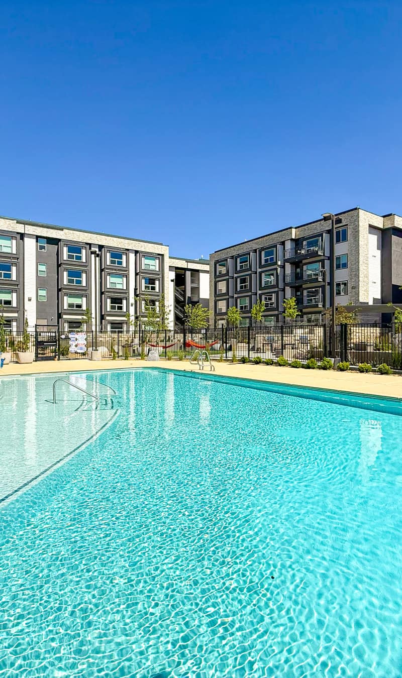 Swimming pool with loungers at Stone Village Apartments in Reno, Nevada