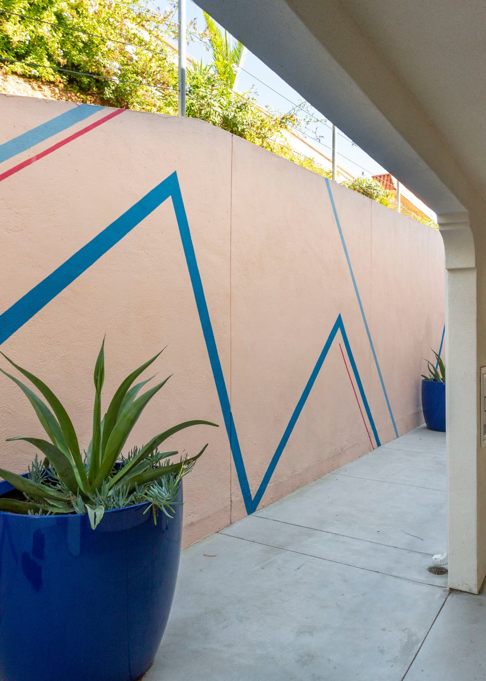Potted plants and artistic walls at Mission West Lofts in San Diego, California
