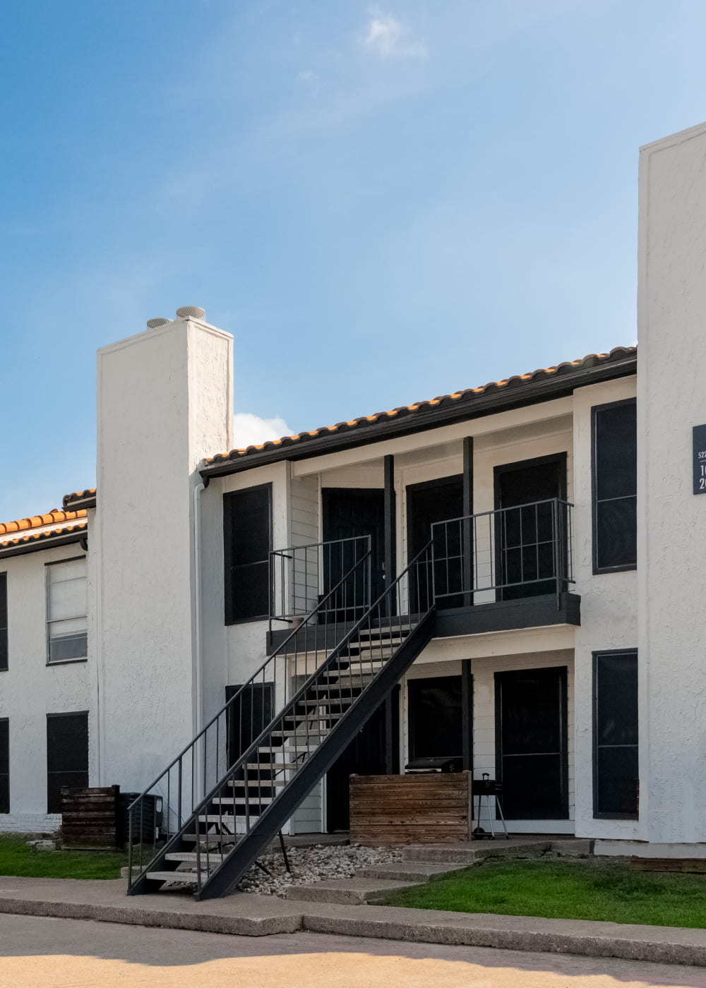 Exterior of building & staircase at Athena Apartment Homes in Benbrook, Texas