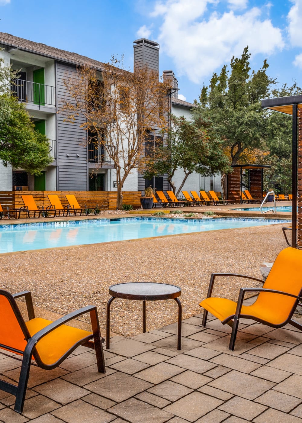 Modern poolside seating at Birch Apartment Homes in Dallas, Texas