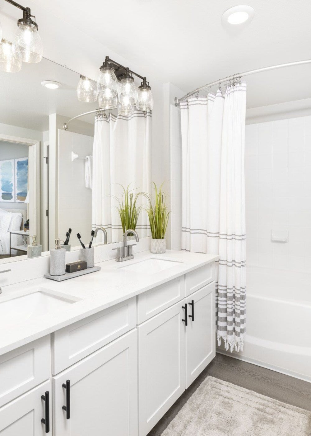 A double vanity in an apartment bathroom at Evergreen at Tuscany Villas in Baton Rouge, Louisiana