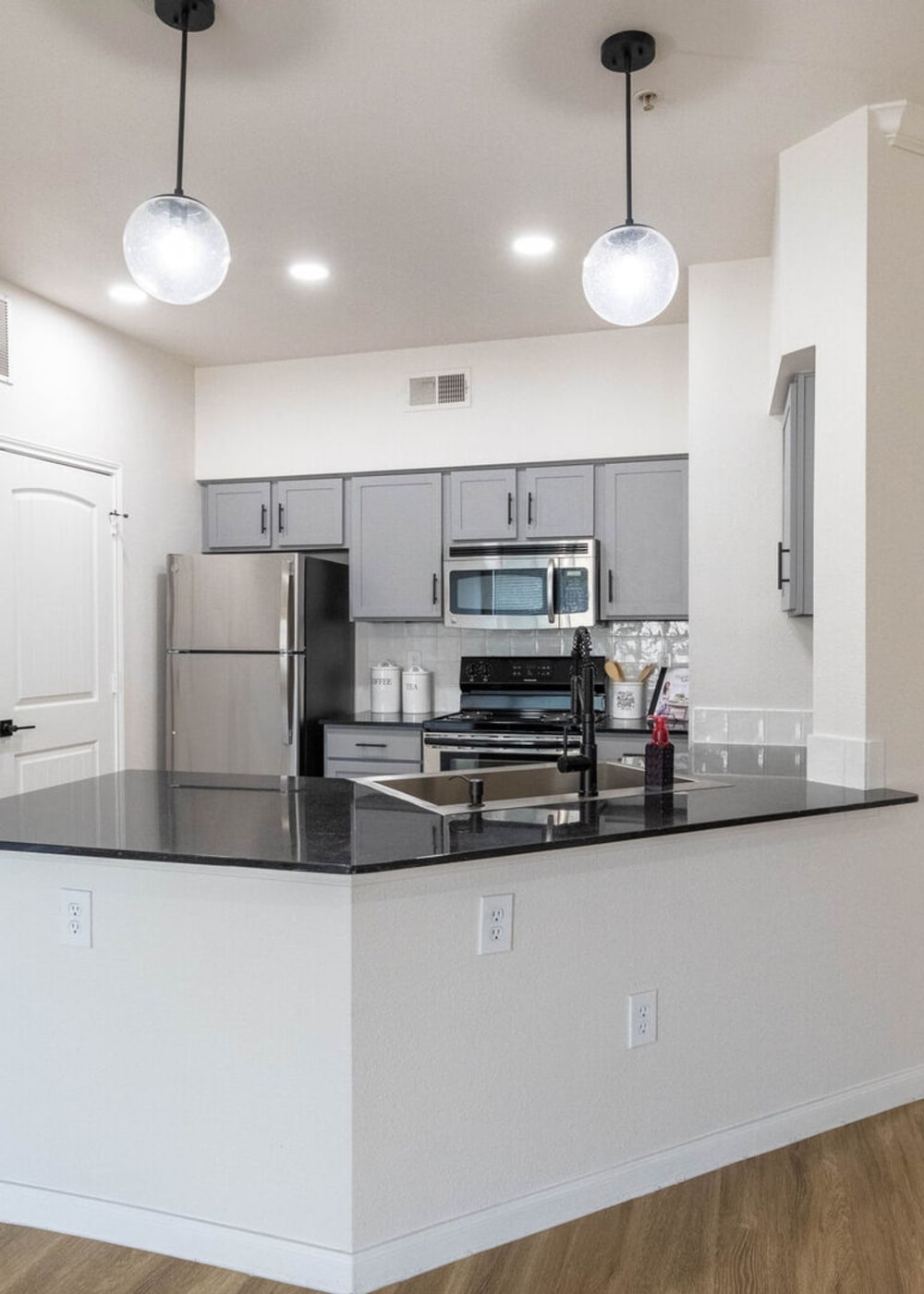 Stainless-steel appliances in an apartment kitchen at Legends Lakeline in Austin, Texas