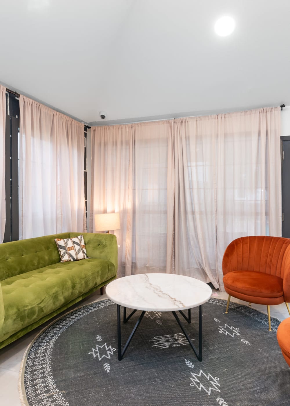 Livingroom with large windows at Fiona Apartment Homes in Irving, Texas