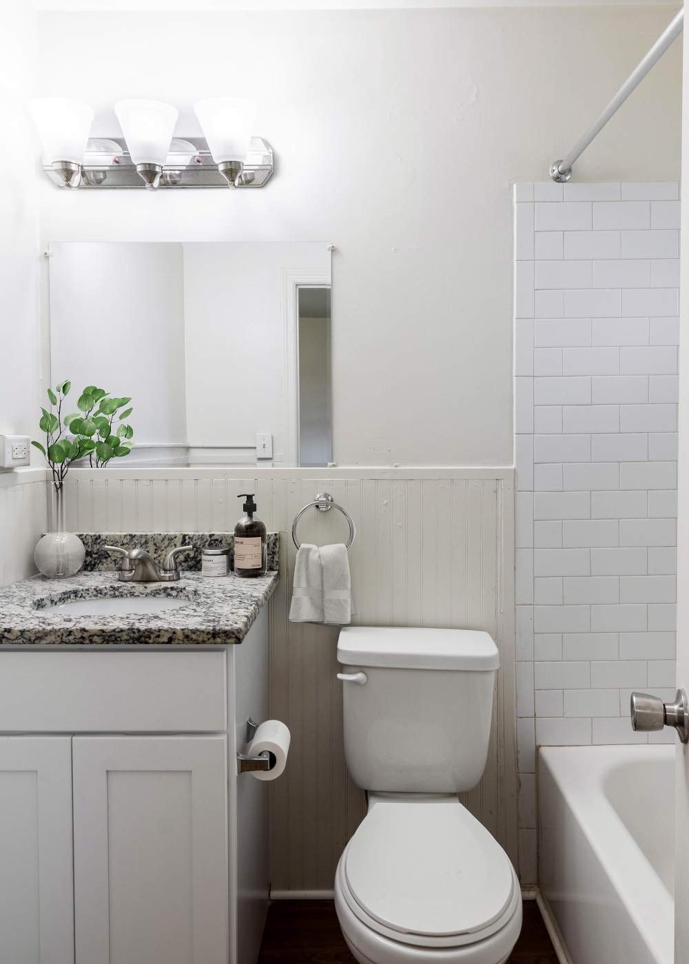 A sink, toilet and bathtub in an apartment bathroom at The Meadows Apartments in Charlottesville, Virginia