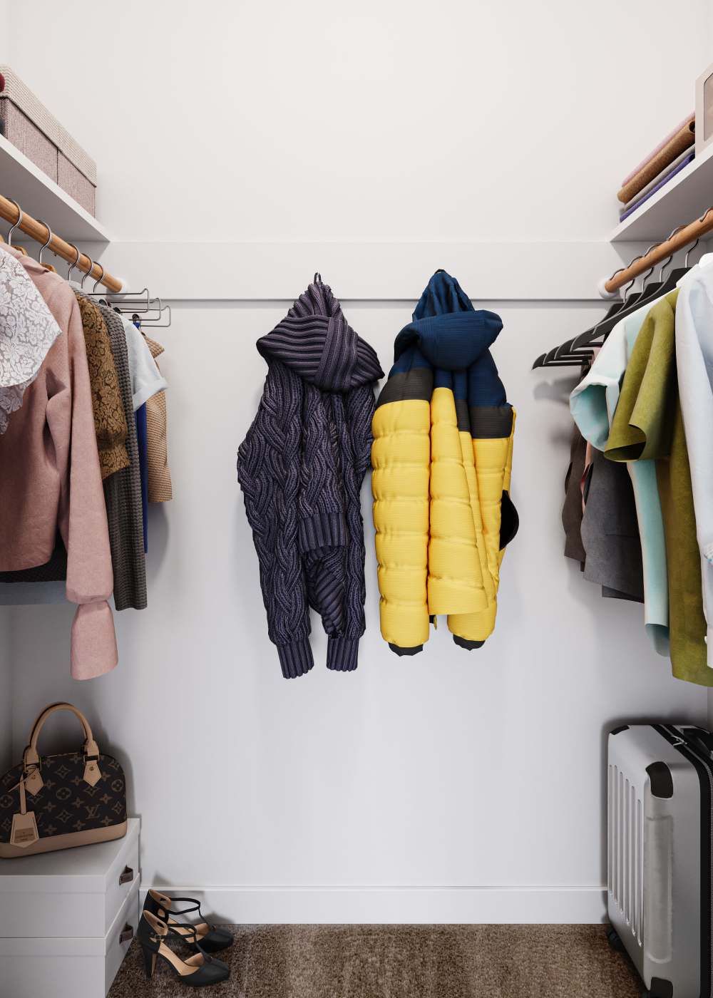 Shelving and coats on hangers in a walk-in closet at The Meadows Apartments in Charlottesville, Virginia