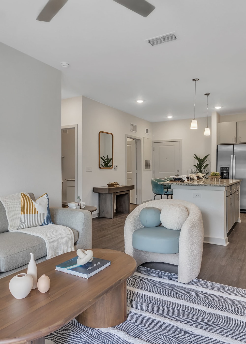 A furnished apartment living room and kitchen at Avocet at Melbourne in Melbourne, Florida
