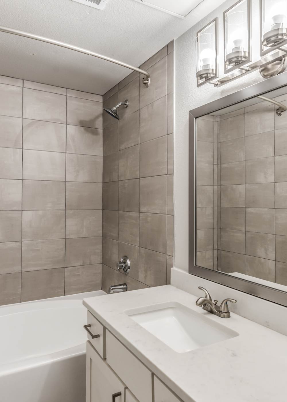 Bathroom with shower and tub at Palomar in Webster, Texas