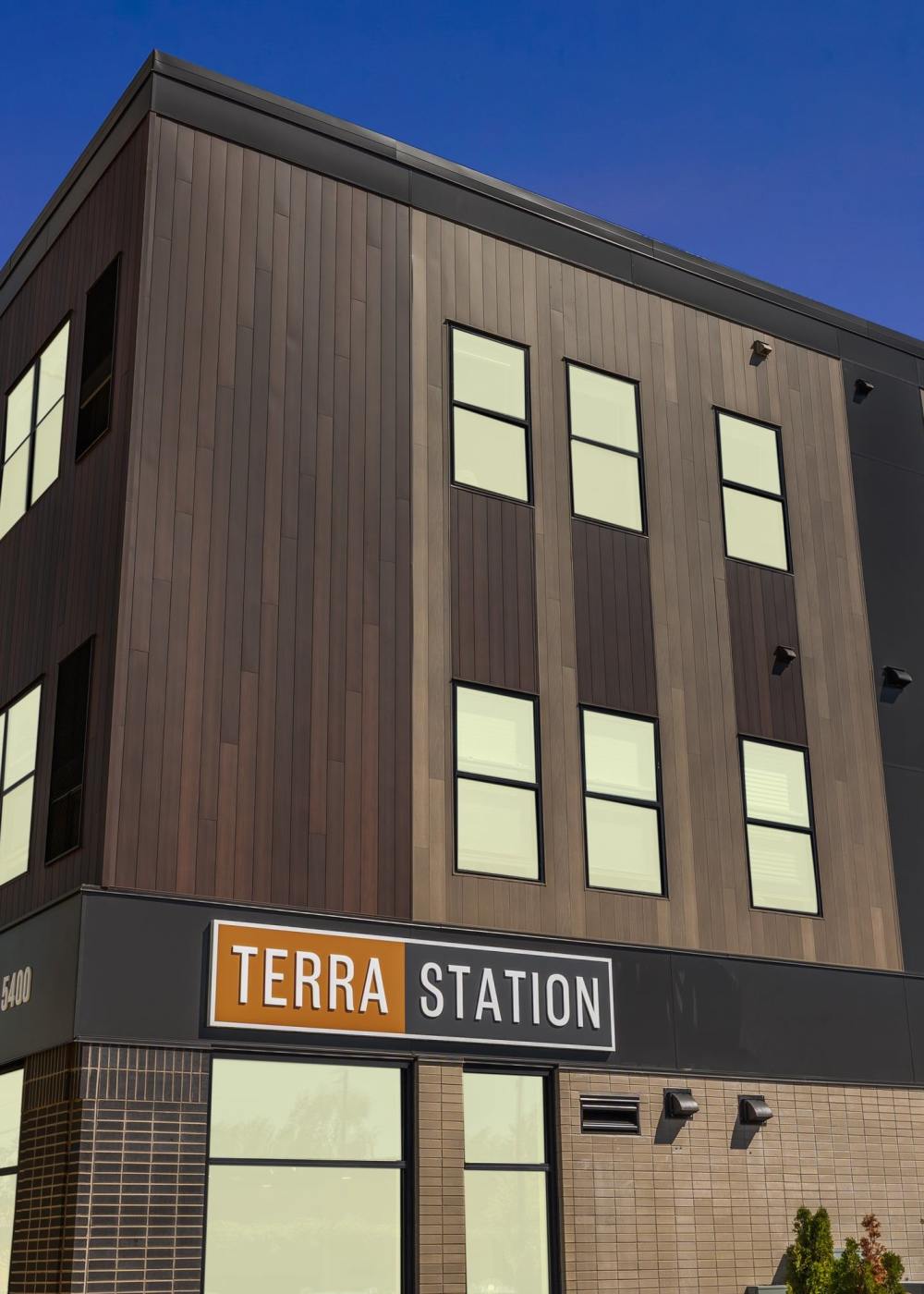Mixed-use apartment community with street-level retail storefronts at Terra Station in Hudsonville, Michigan