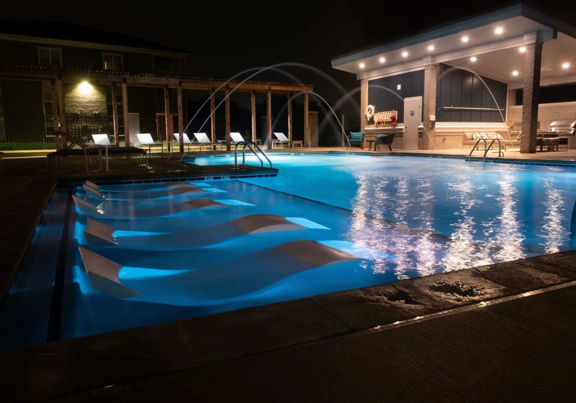 pool at night at ((location_name}} in Avon, IN