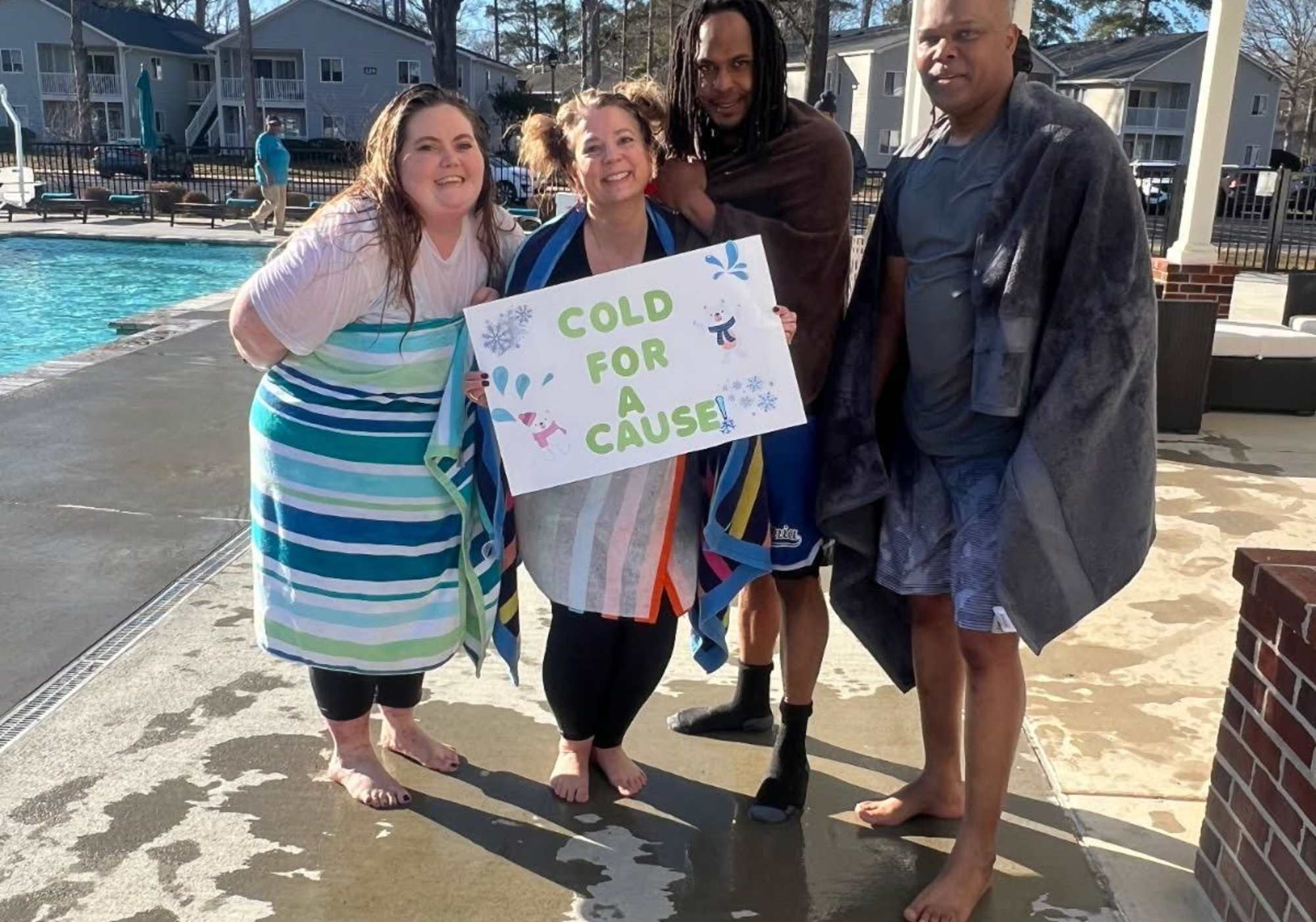 Employees holding a message on the streets at Drucker + Falk in Newport News Virginia