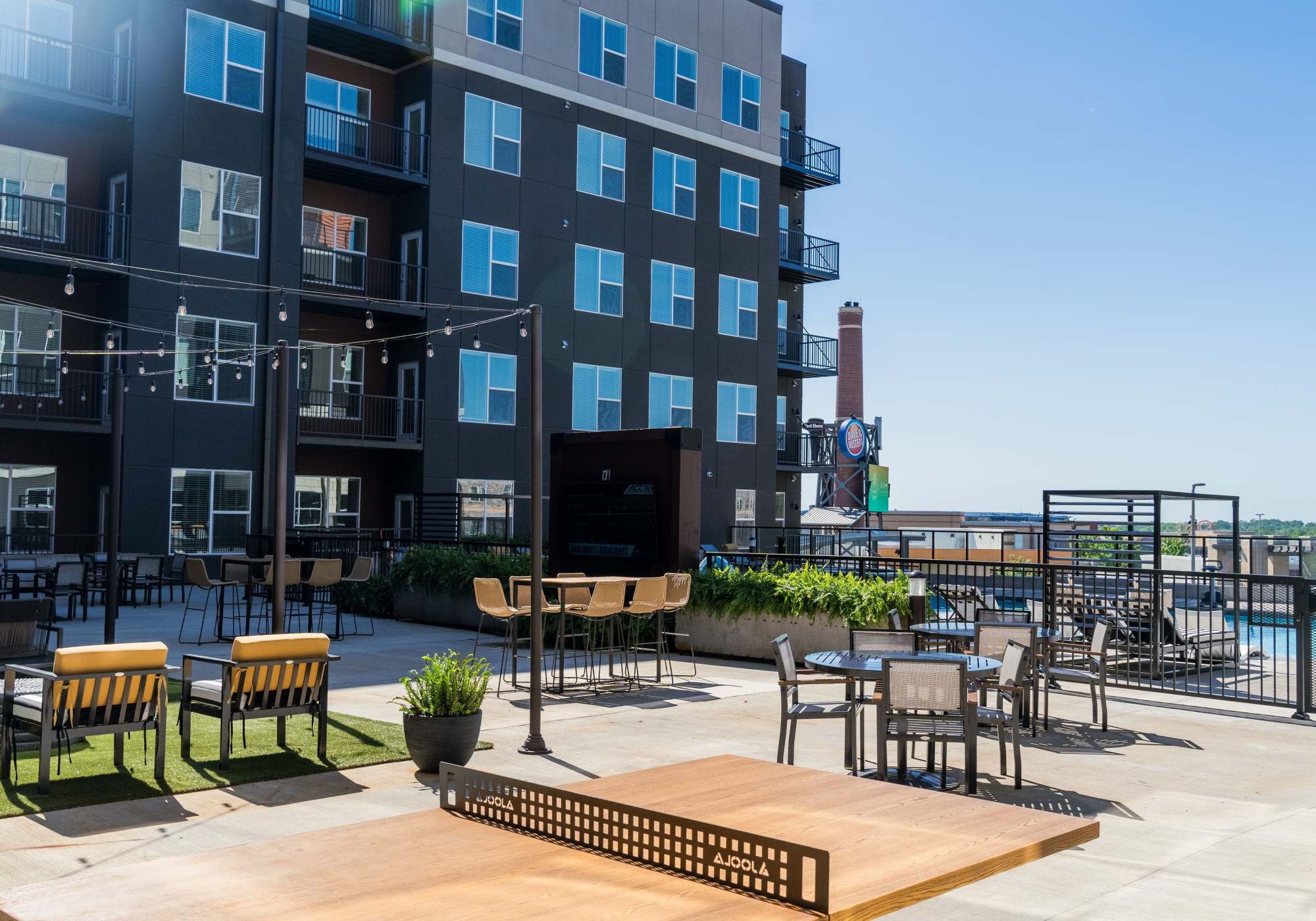 Residents playing in pool at Legends 267 Apartments in Kansas City, Kansas