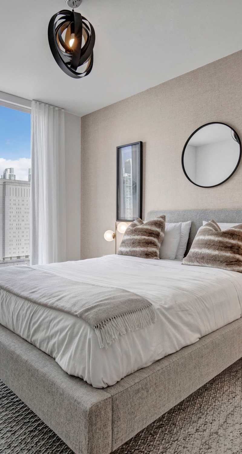 Spacious bedroom with soft carpet at ParkLine Miami in Miami, Florida