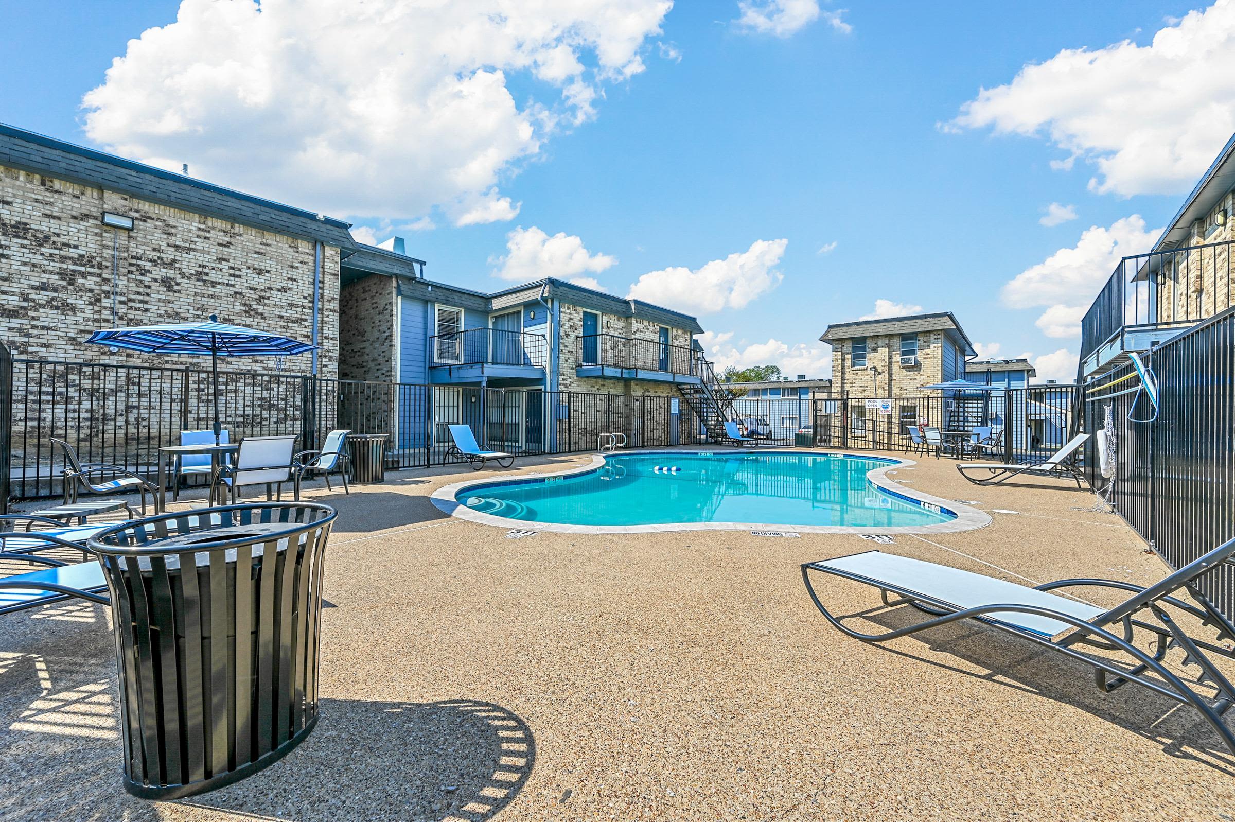 Sparkling salt-water swimming pool and lounge beds atFinley Square in Irving. TX