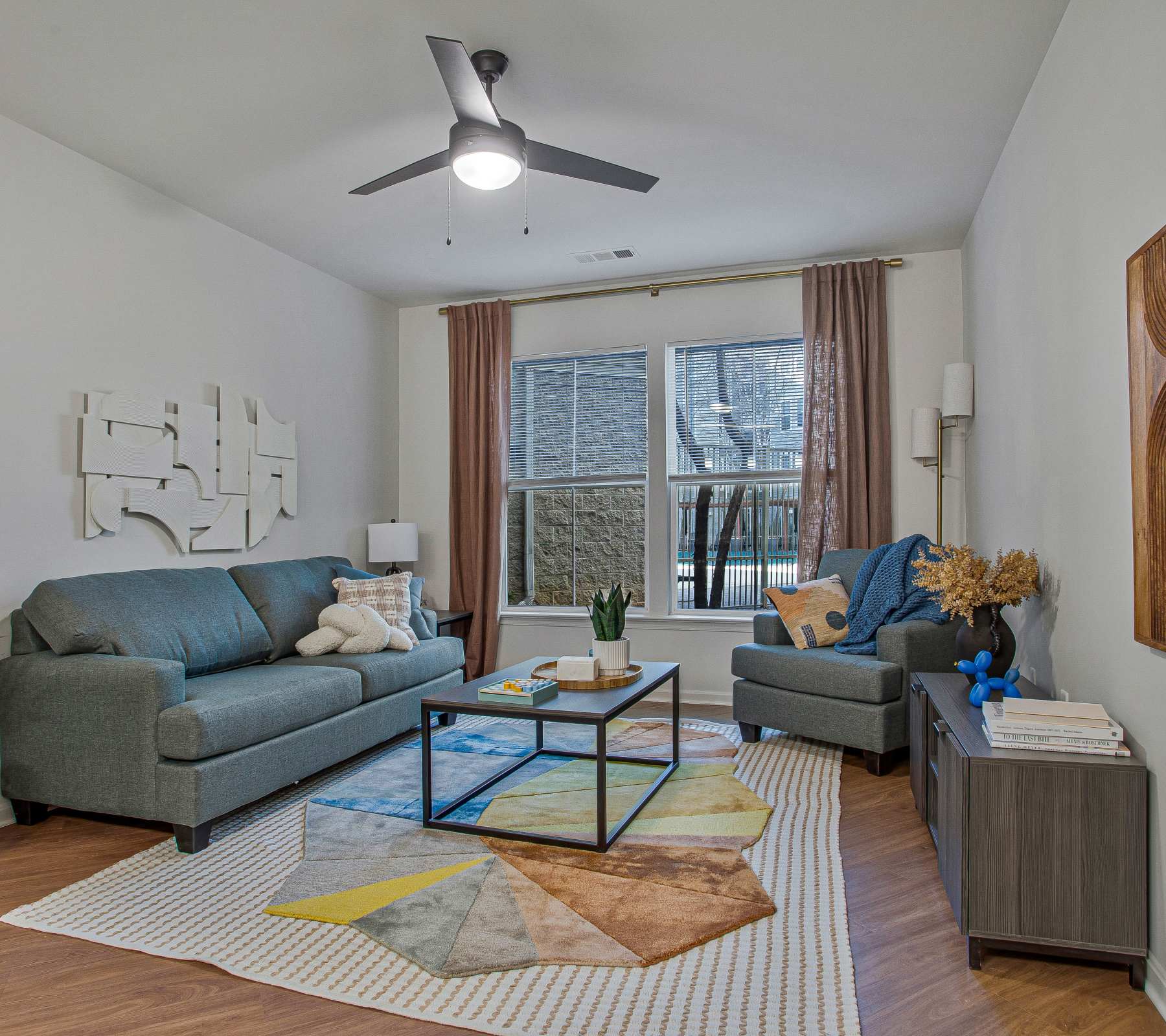 Newly renovated, modern kitchen with white cabinets and black appliances at Mazza Grandmarc in College Park, Maryland