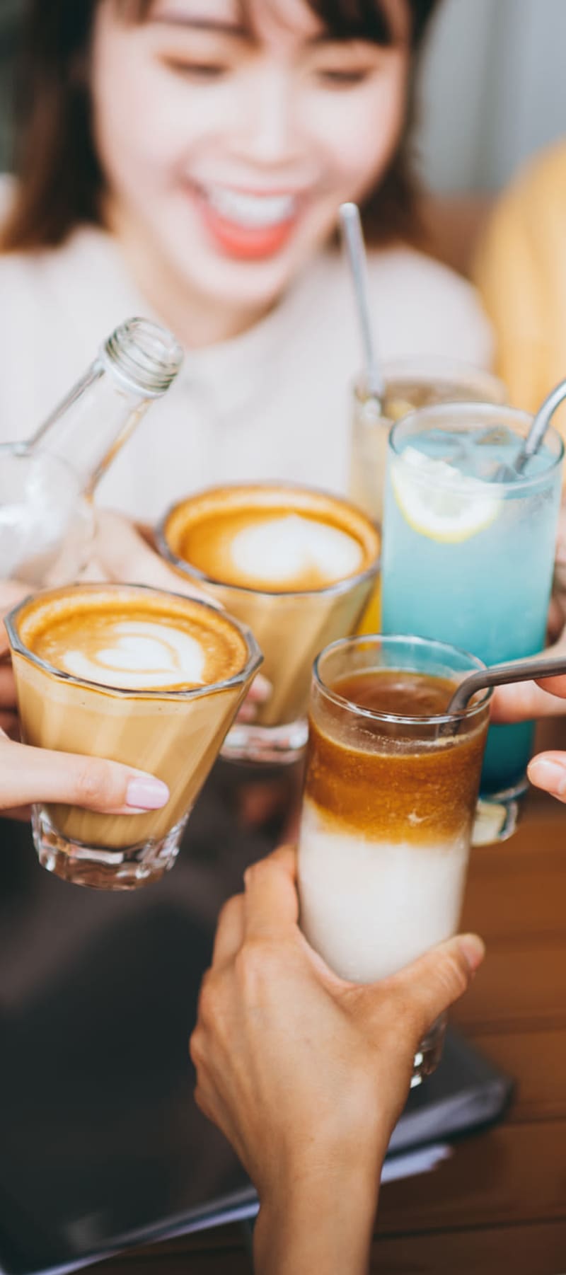 Colleagues raising a toast at a café near 17th Street Lofts in Atlanta, Georgia