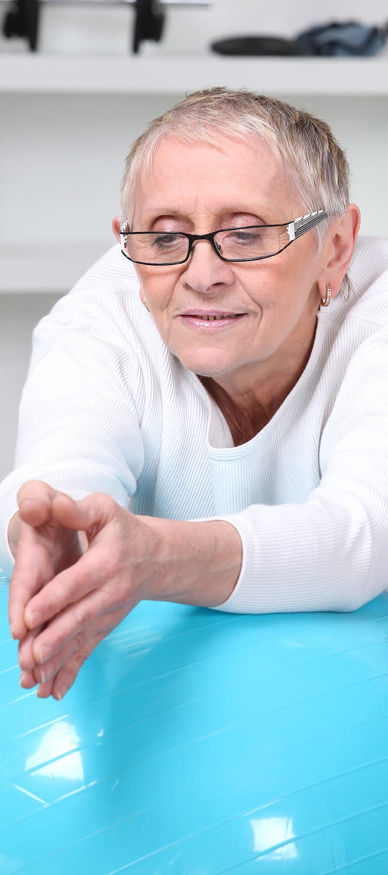 Resident working on an exercise ball at East Troy Manor in East Troy, Wisconsin