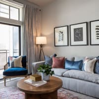 Cozy living room with private balcony at Bellrock Sawyer Yards in Houston, Texas